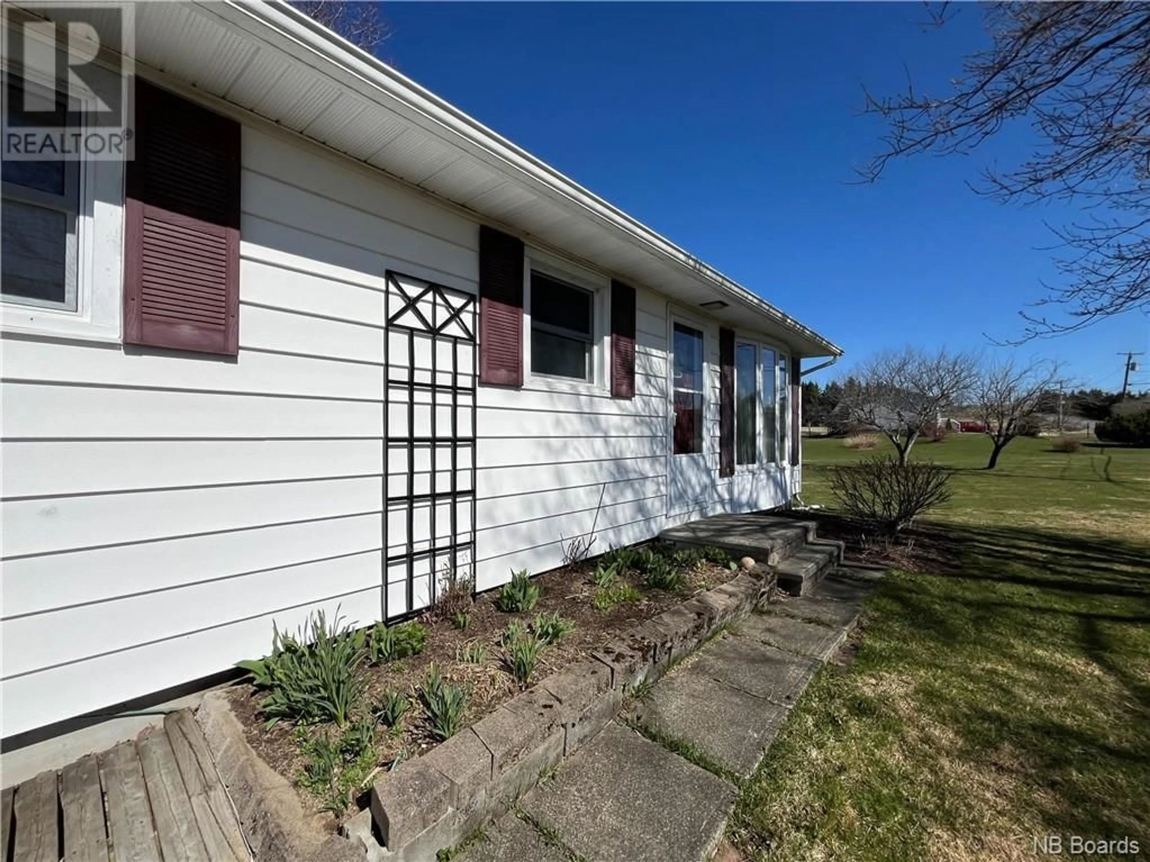 Frontside or backside of a home, cottage for 15 McElroy Road, Beechwood New Brunswick E7J1Y8