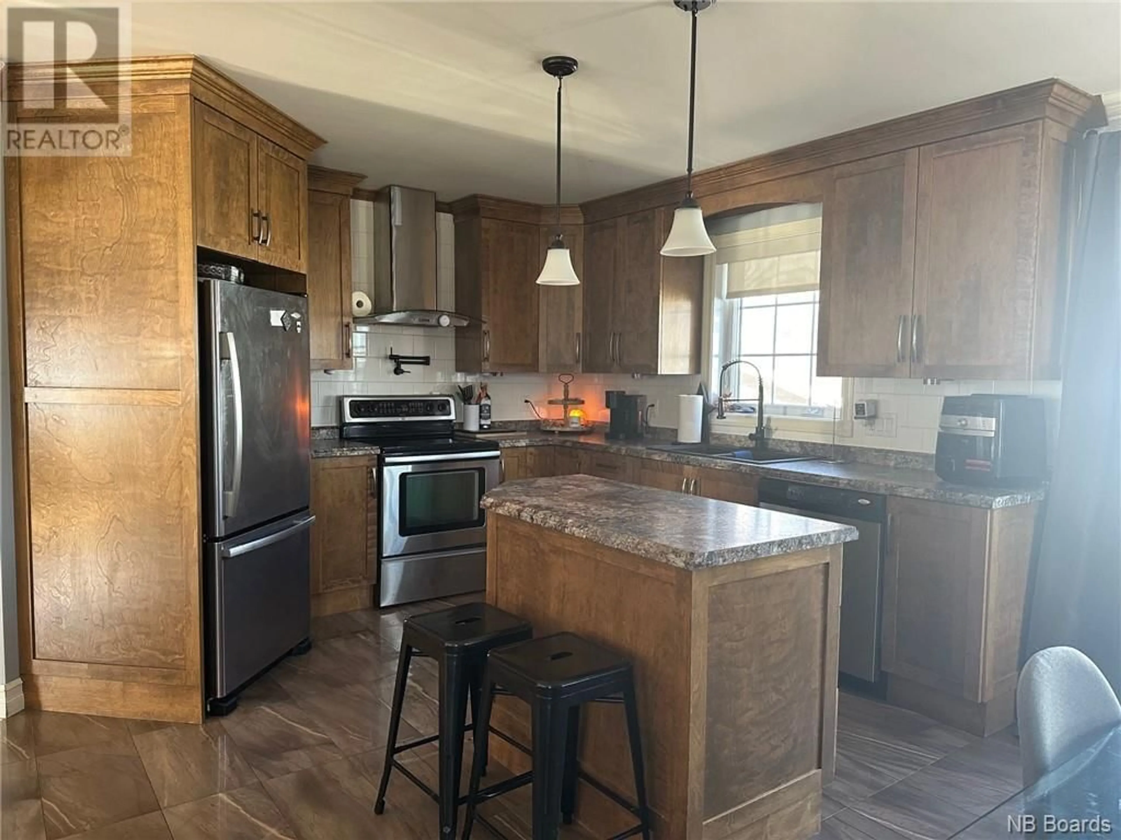 Open concept kitchen for 107 Lansdowne Street, Campbellton New Brunswick E3N2M6