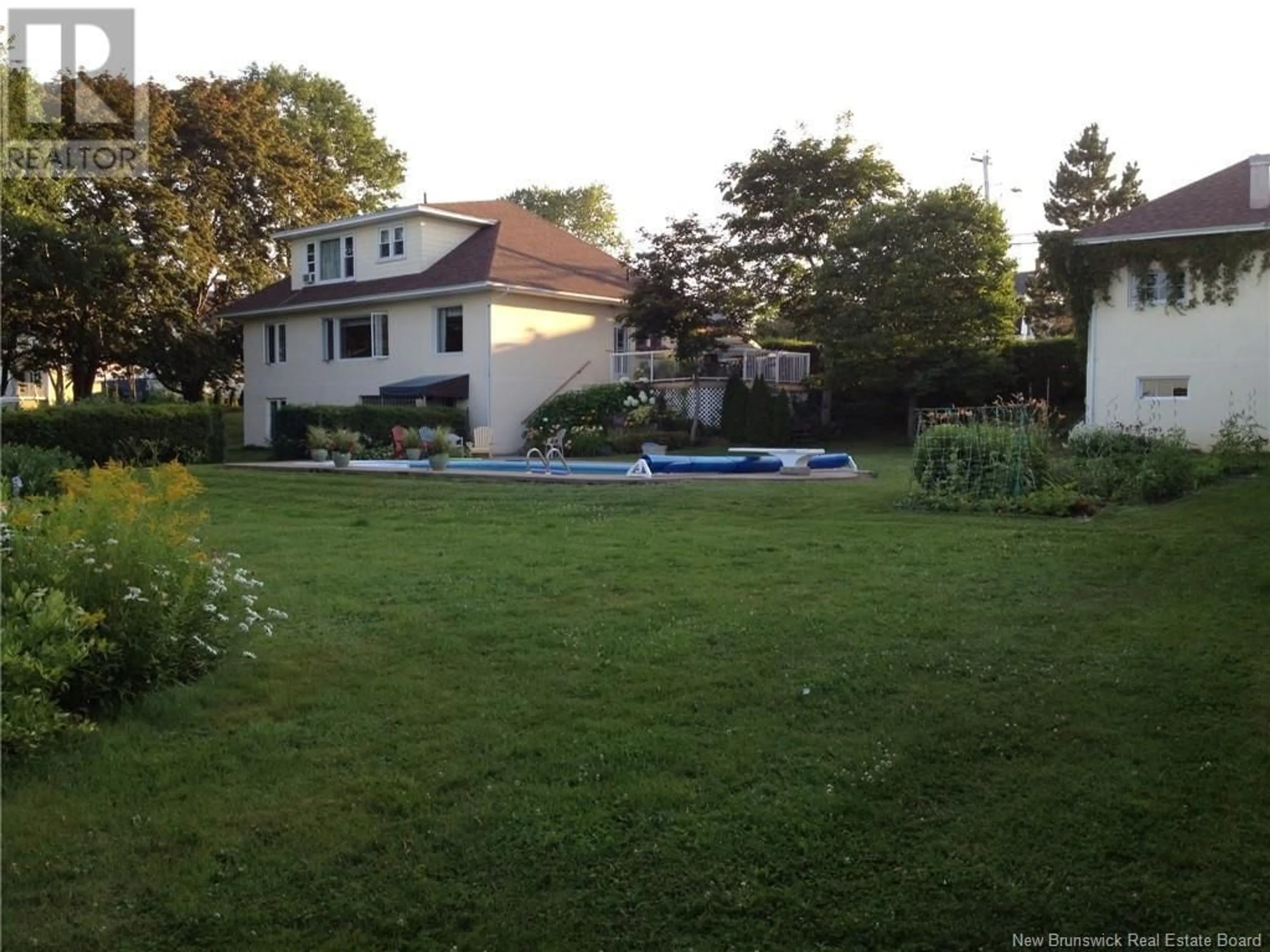 A pic from outside/outdoor area/front of a property/back of a property/a pic from drone, unknown for 555 RIVERSIDE DRIVE, Bathurst New Brunswick E2A2M4