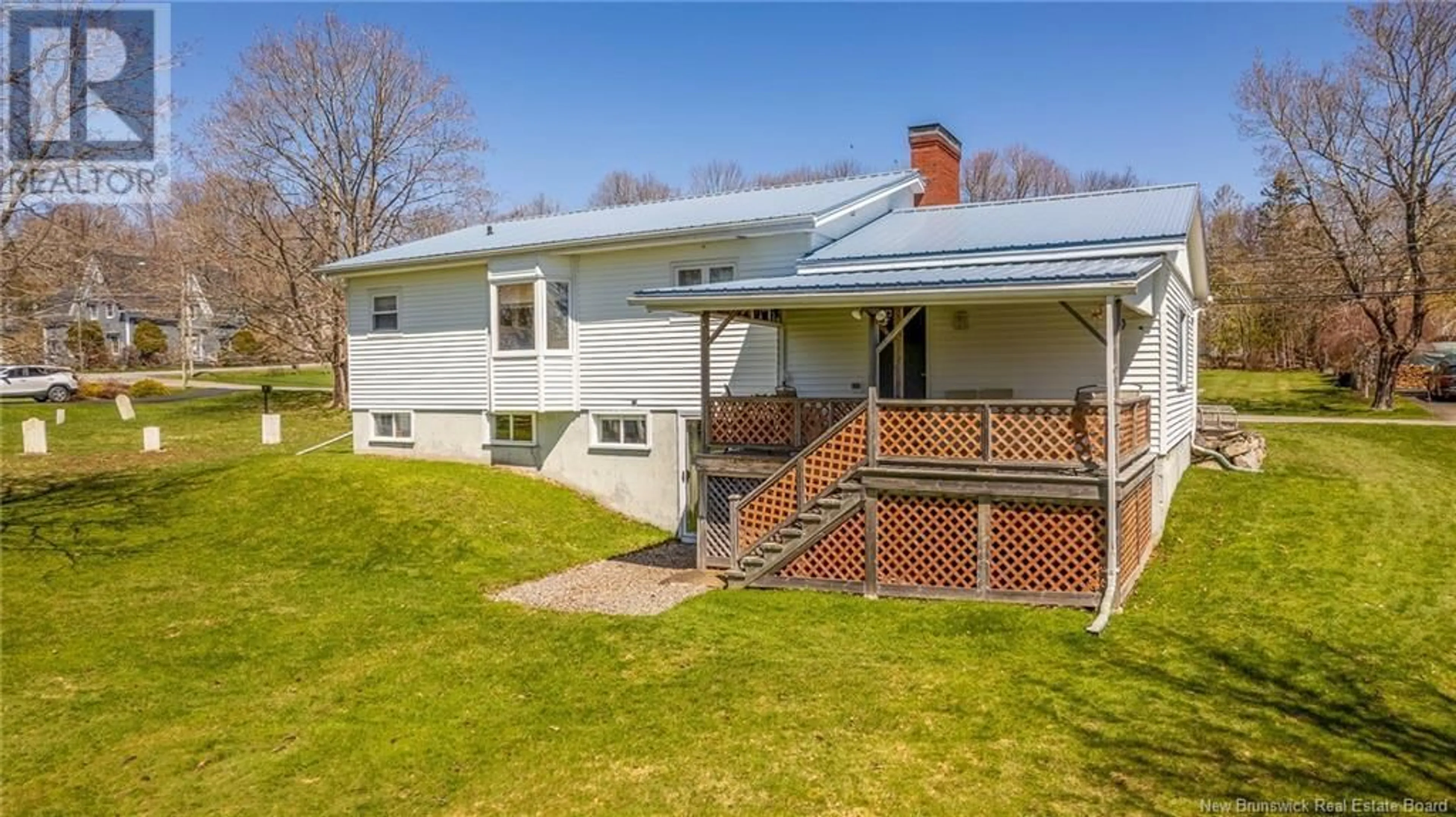 Frontside or backside of a home, the fenced backyard for 147 Parr Street, Saint Andrews New Brunswick E5B1K8