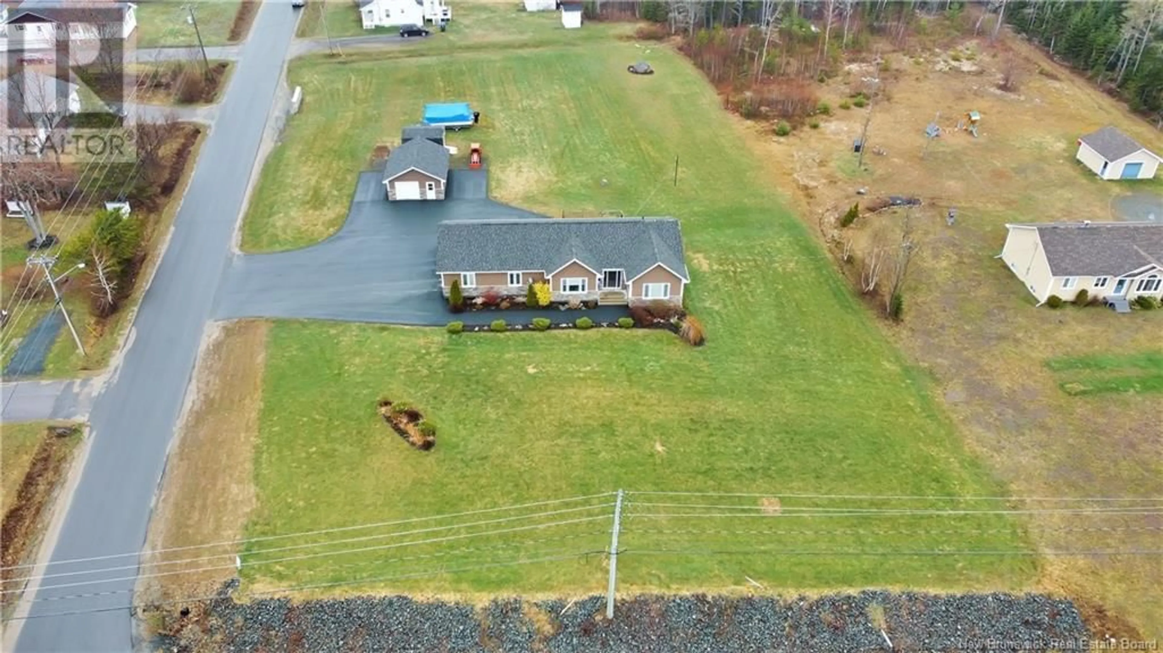 Frontside or backside of a home, the fenced backyard for 118 O'KEEFE Road, Miramichi New Brunswick E1V6J2