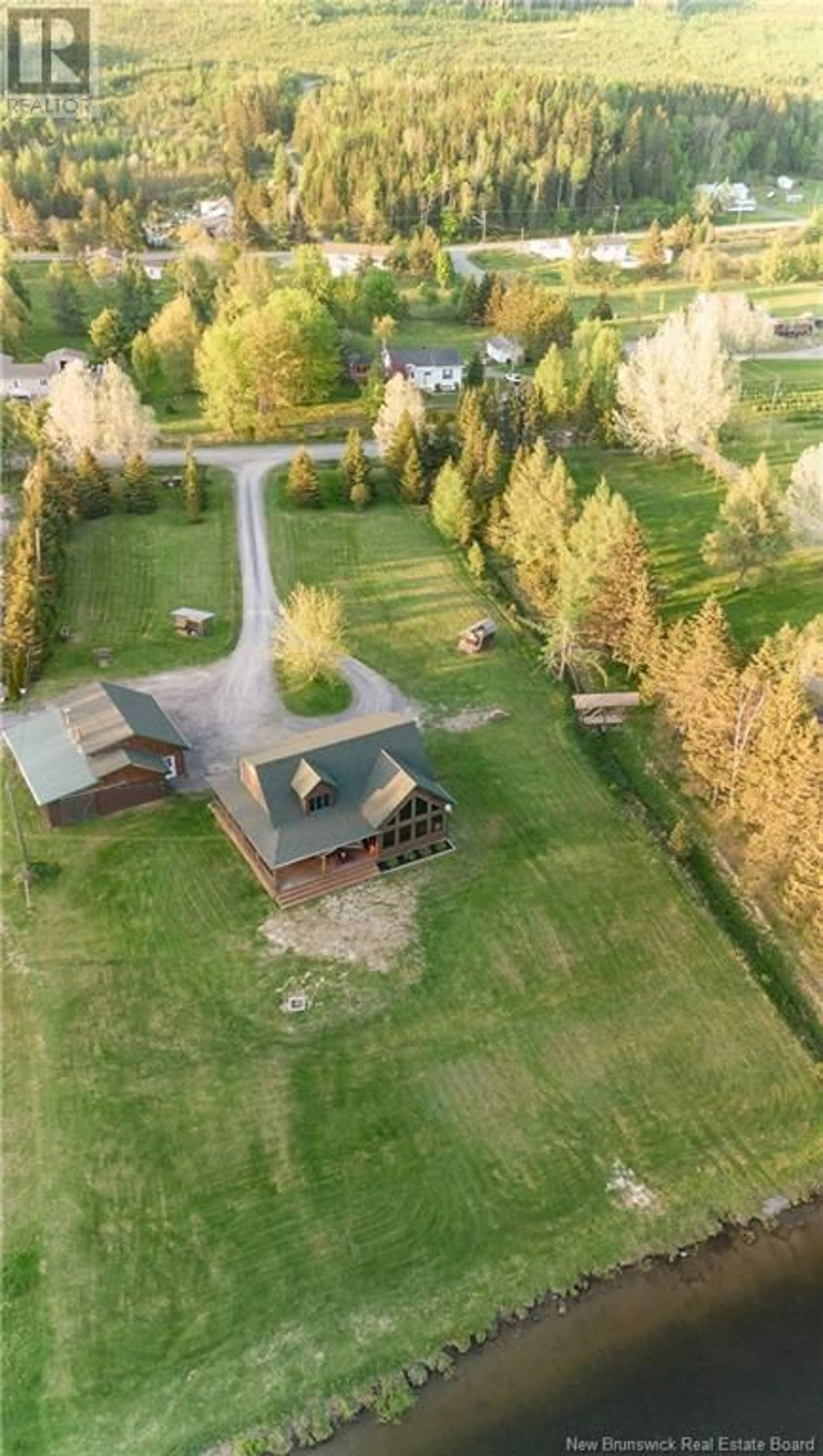 Frontside or backside of a home, the fenced backyard for 32 Bellefleur Street, Saint-Jacques New Brunswick E7B2B1