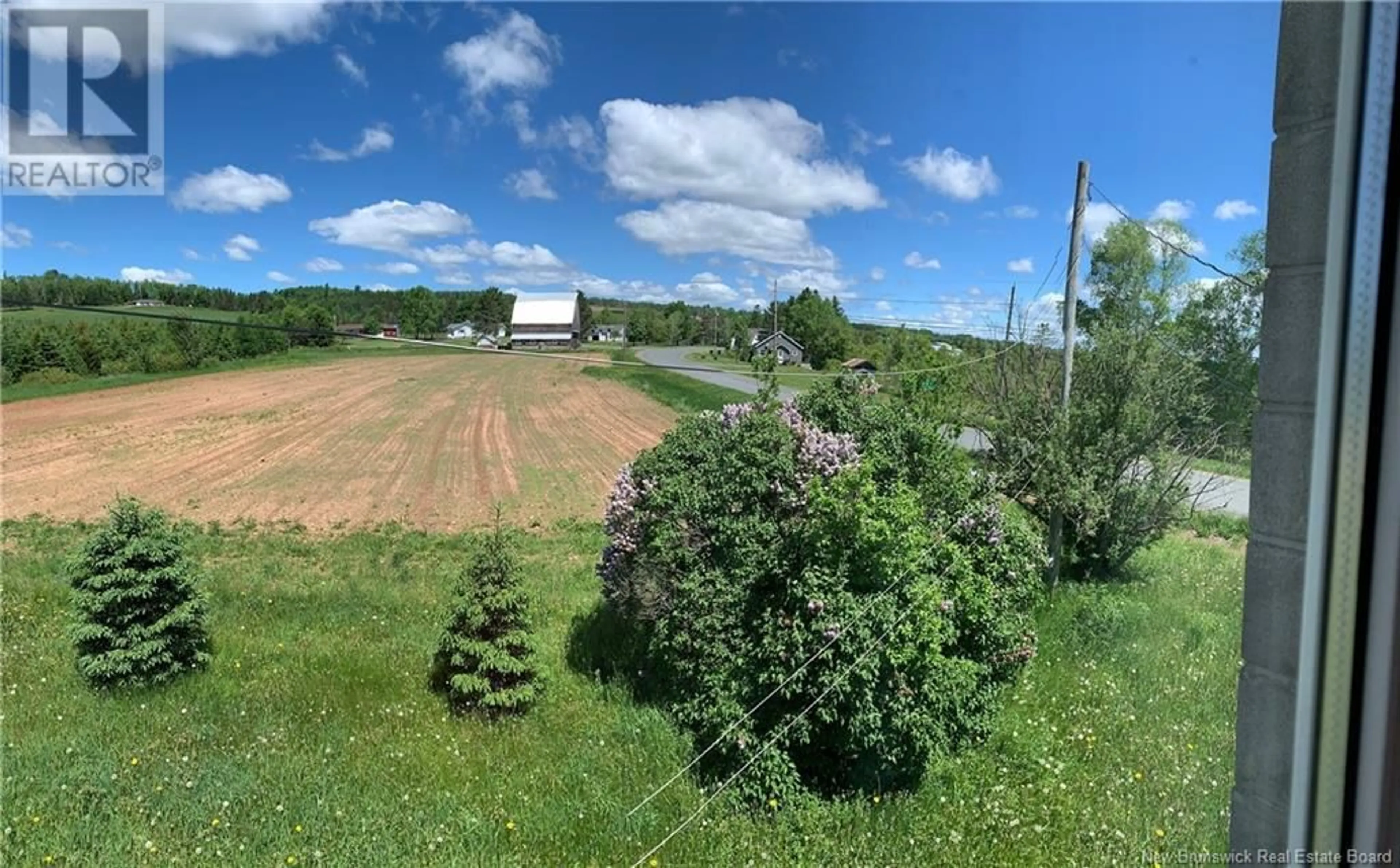 A pic from exterior of the house or condo, the fenced backyard for 1937 Rte 109, Arthurette New Brunswick E7H4B4