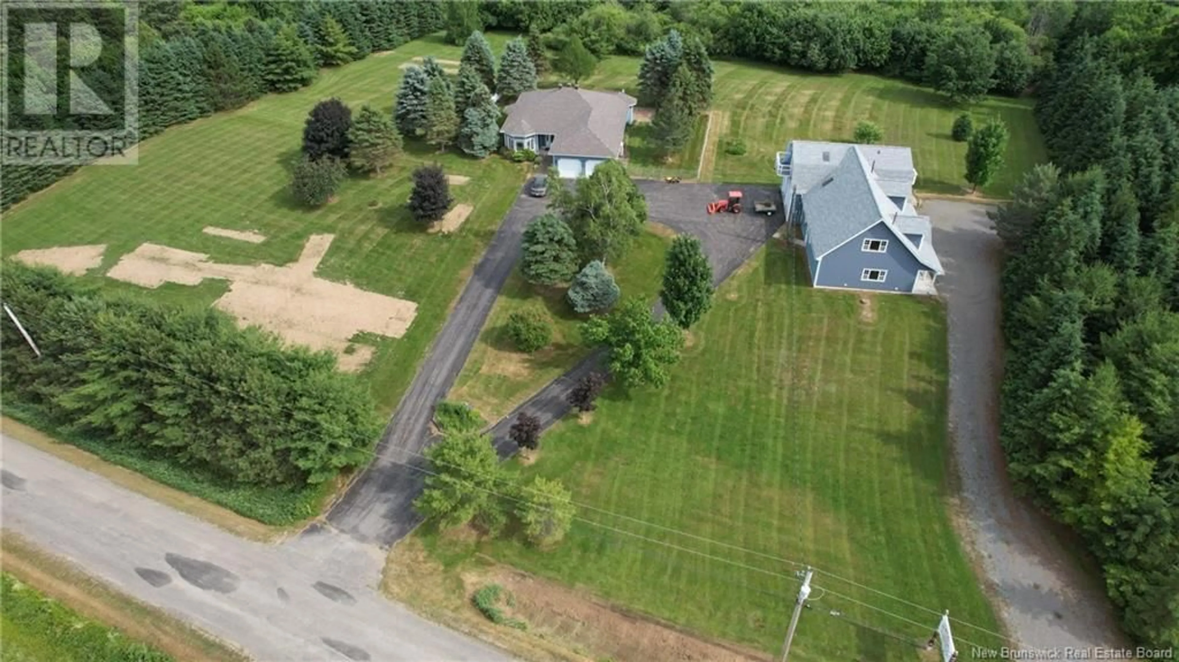 A pic from exterior of the house or condo, the fenced backyard for 15 & 17 MacDonald Road, Upper Woodstock New Brunswick E7M3C3