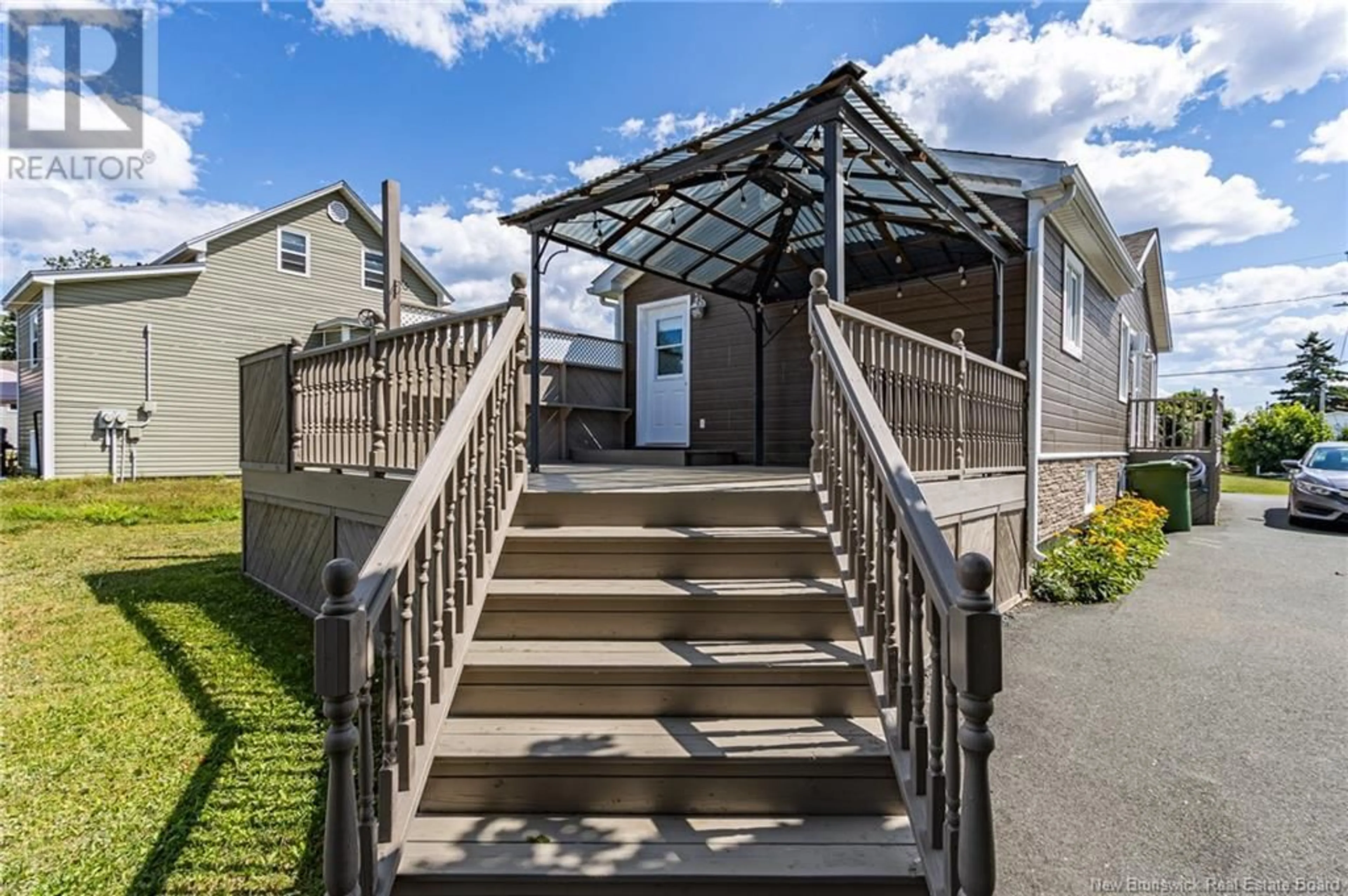 A pic from exterior of the house or condo, the fenced backyard for 377 Rue Coughlan, Tracadie New Brunswick E1X1B3