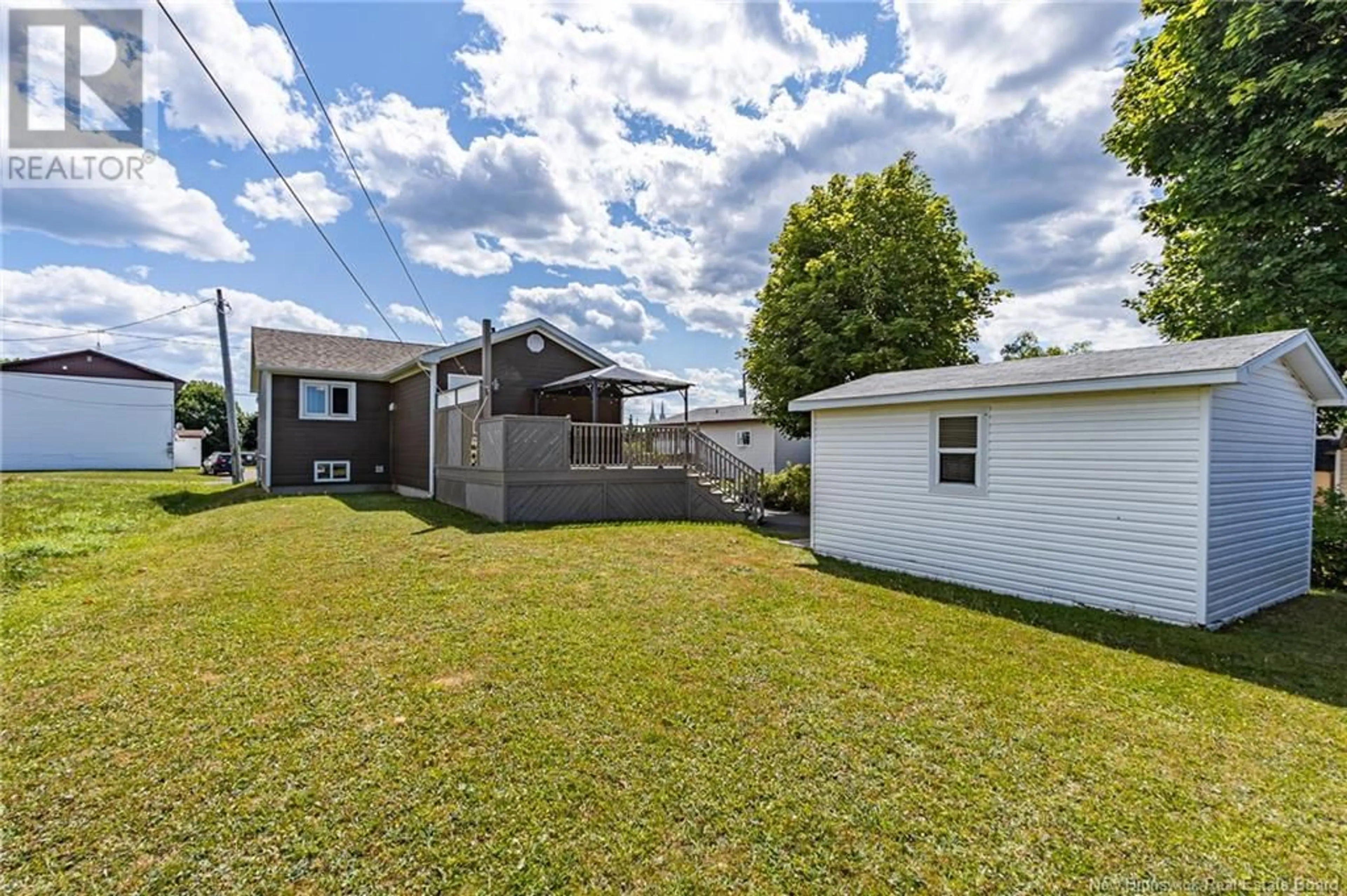 Frontside or backside of a home, the fenced backyard for 377 Rue Coughlan, Tracadie New Brunswick E1X1B3