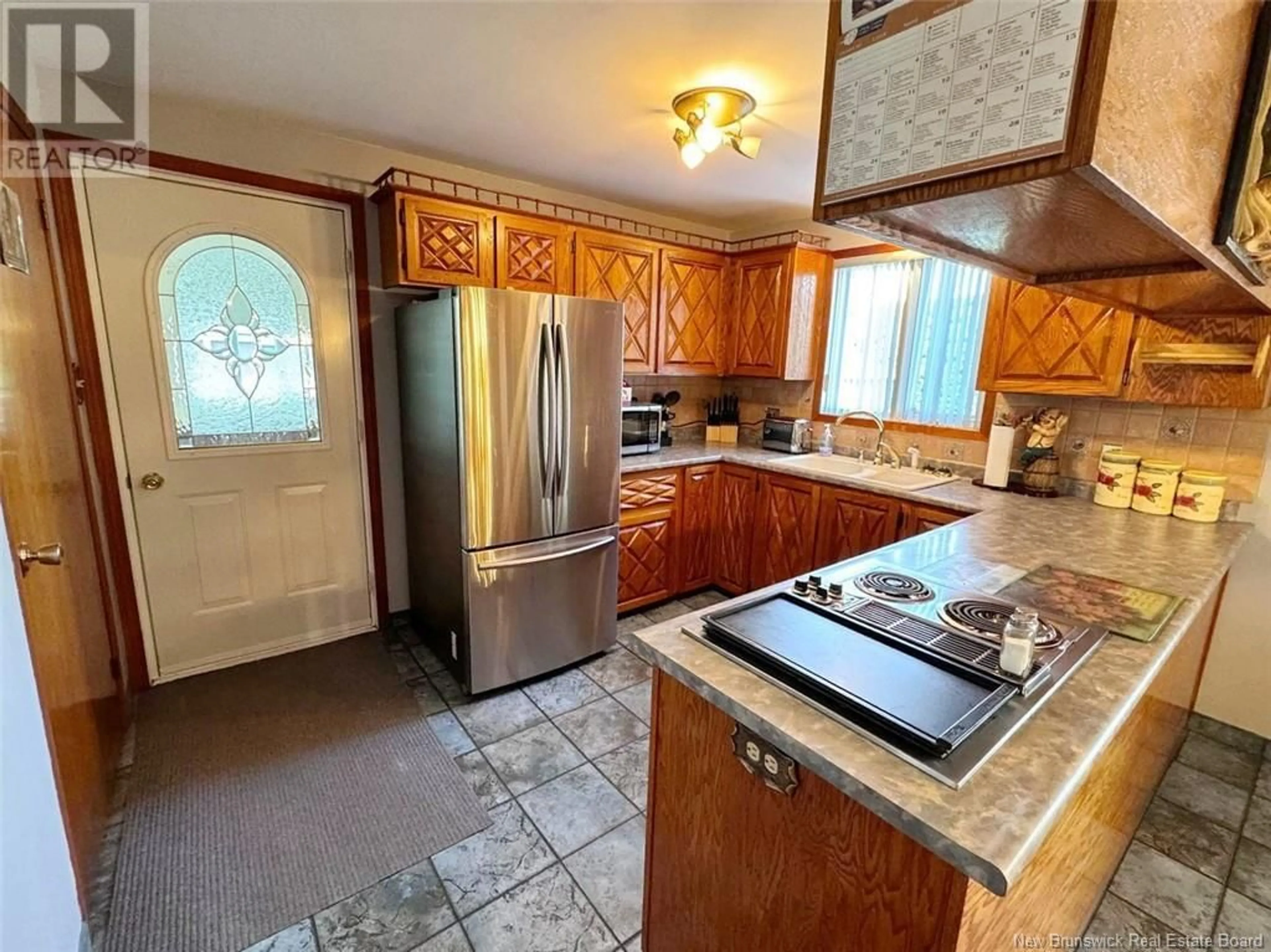 Kitchen, wood floors, cottage for 46 Boucher Street, Saint-Jacques New Brunswick E7B1B8