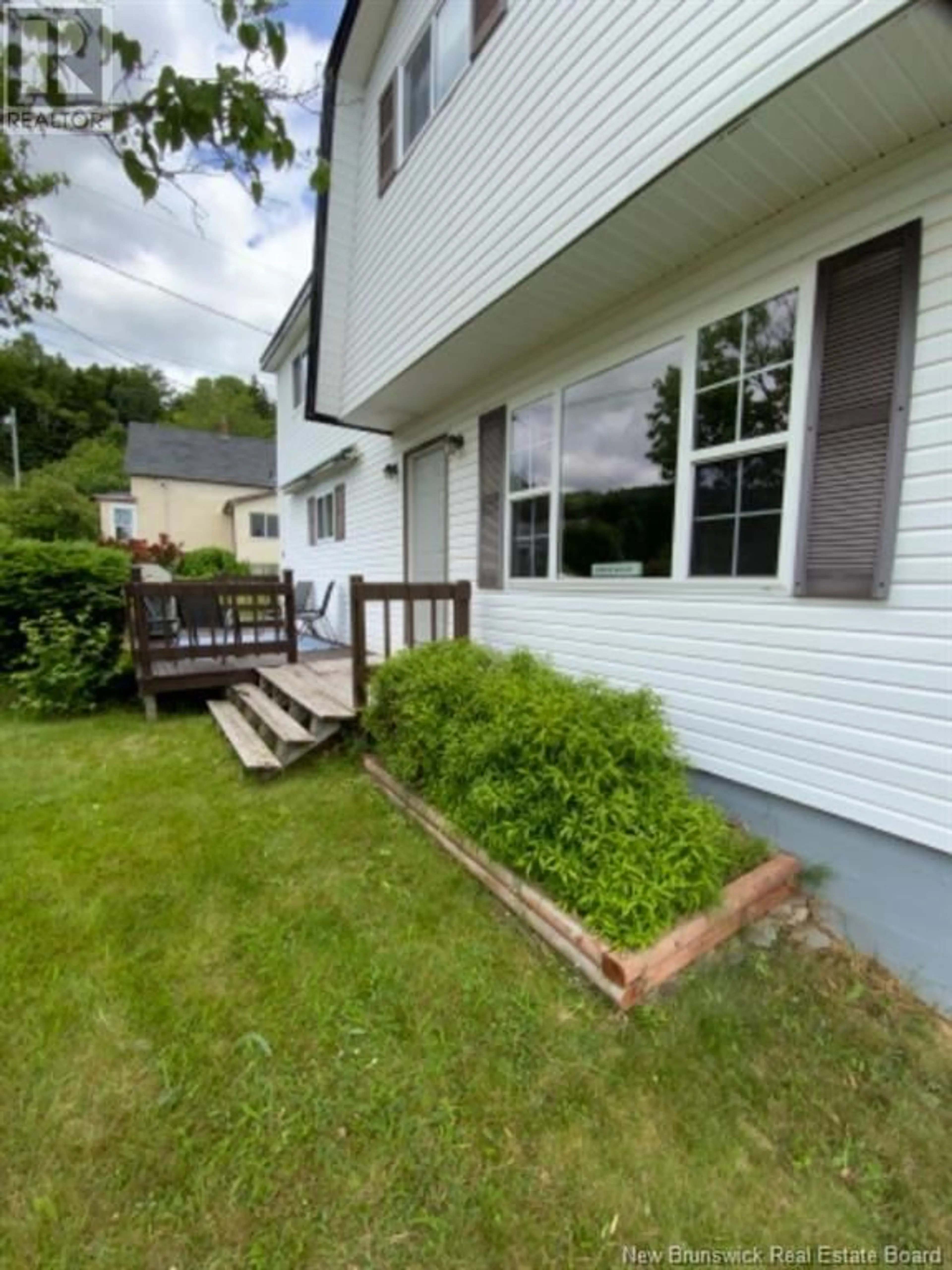 Patio, the fenced backyard for 48 Fundy View Drive, Alma New Brunswick E4H1H7