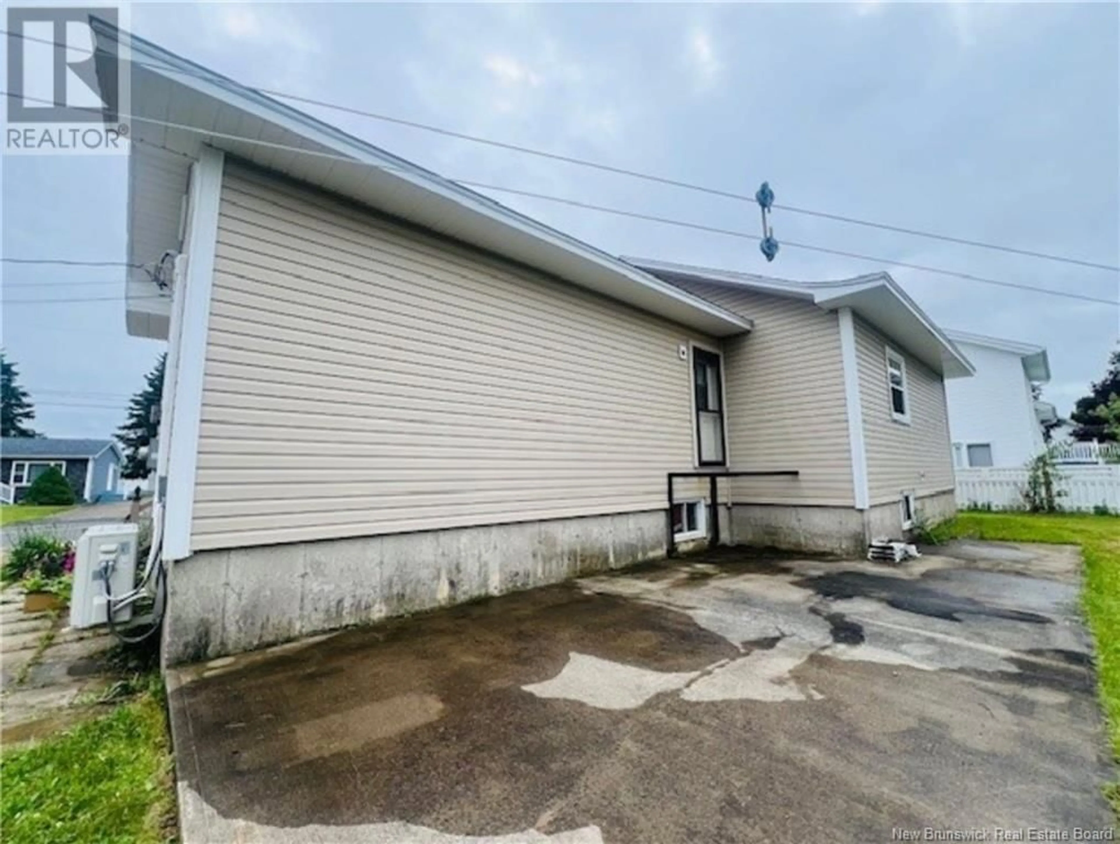 Frontside or backside of a home, the front or back of building for 511 Rue Boisjoli, Tracadie New Brunswick E1X1A6