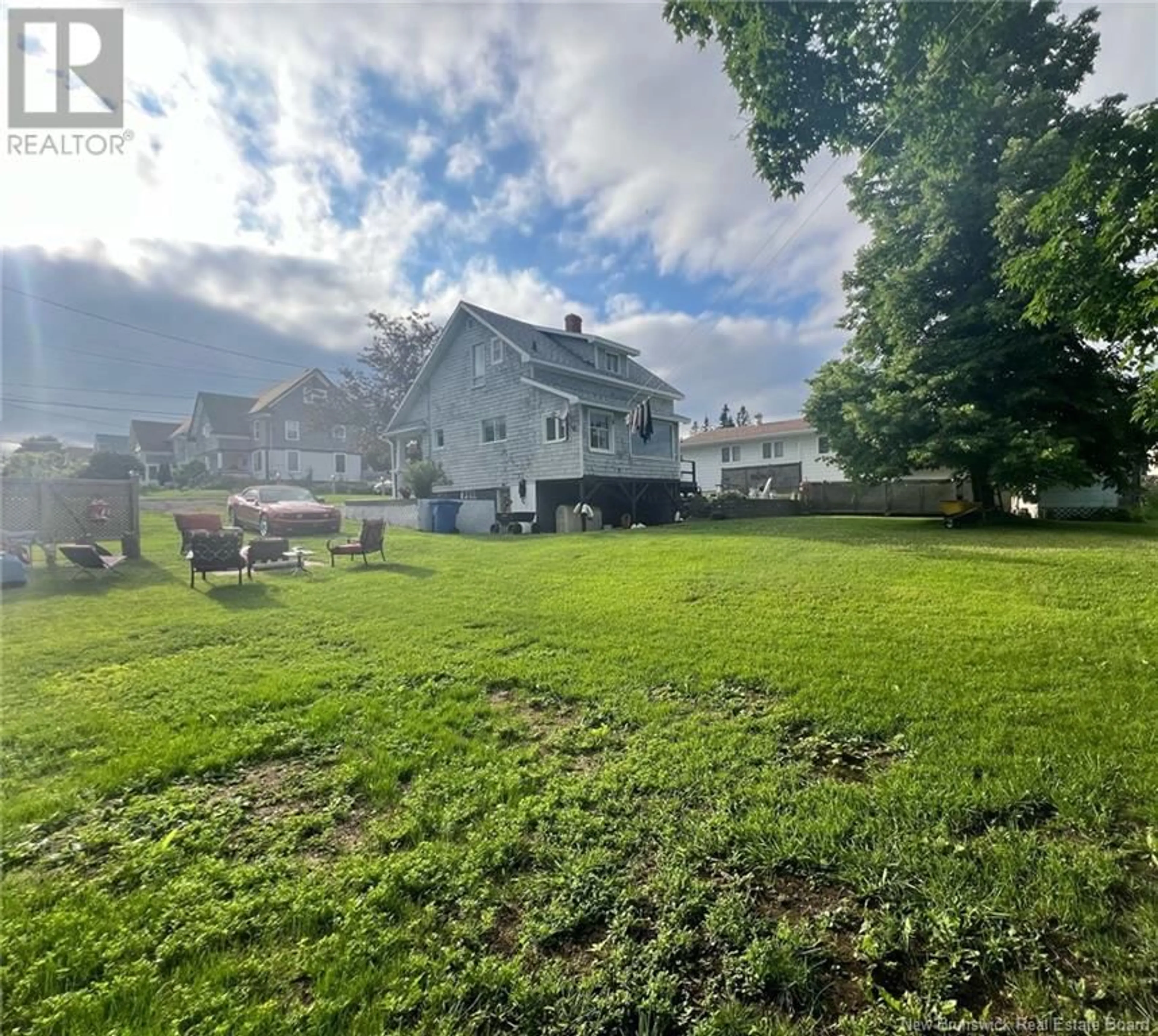 Frontside or backside of a home, the fenced backyard for 165 Orchard Street, Dalhousie New Brunswick E8C2C3