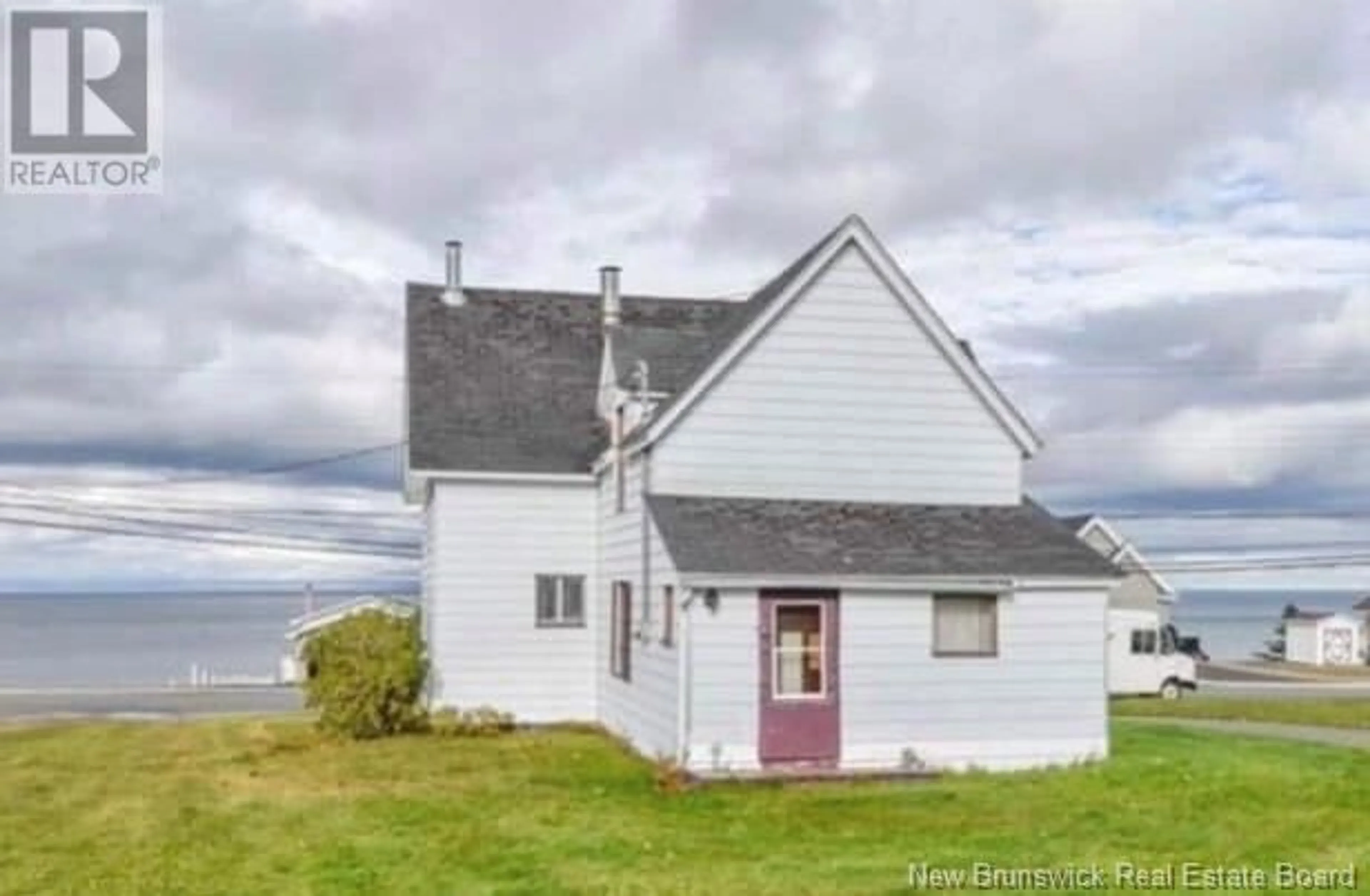 Frontside or backside of a home, cottage for 106 St-Pierre E Street, Caraquet New Brunswick E1W1A9