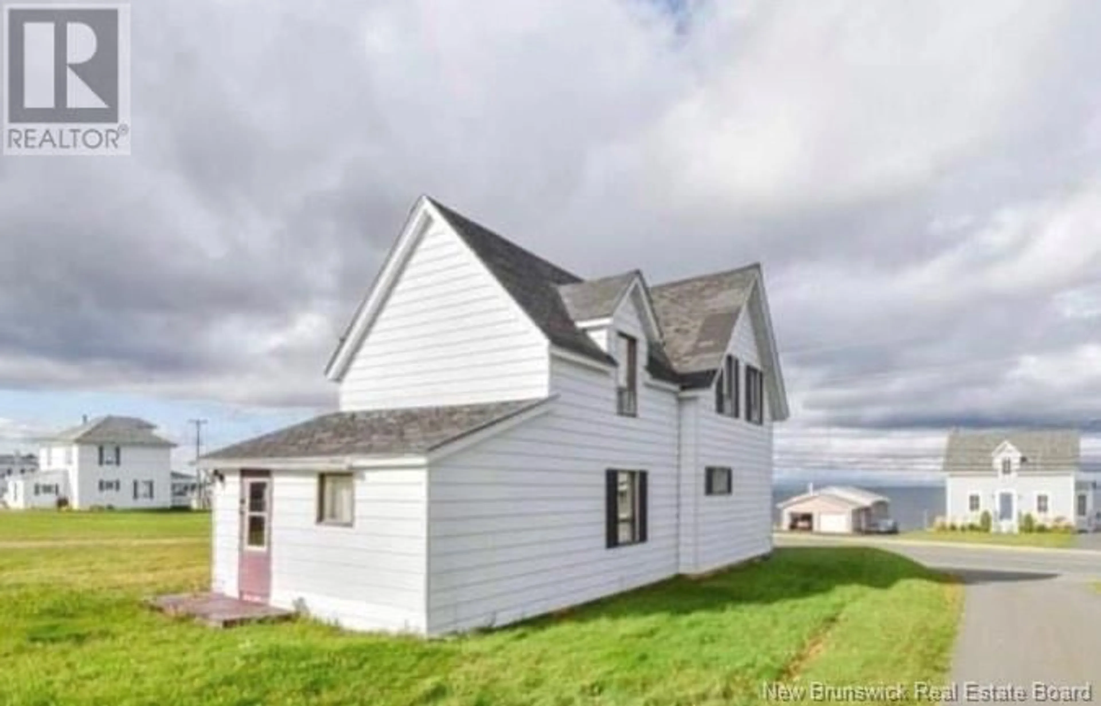 Frontside or backside of a home, cottage for 106 St-Pierre E Street, Caraquet New Brunswick E1W1A9