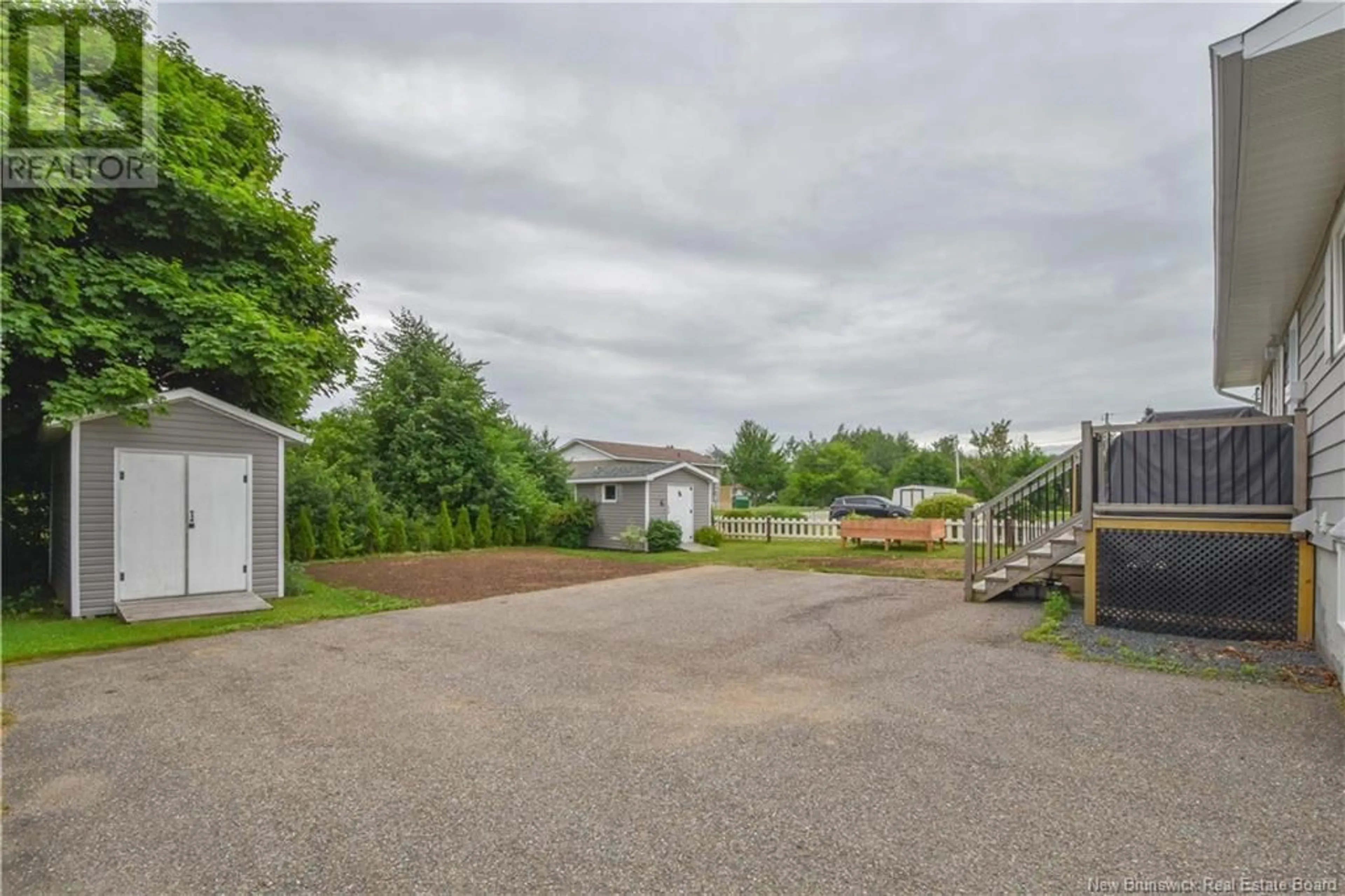 A pic from exterior of the house or condo, the fenced backyard for 530 Breau Street, Tracadie New Brunswick E1X1B5