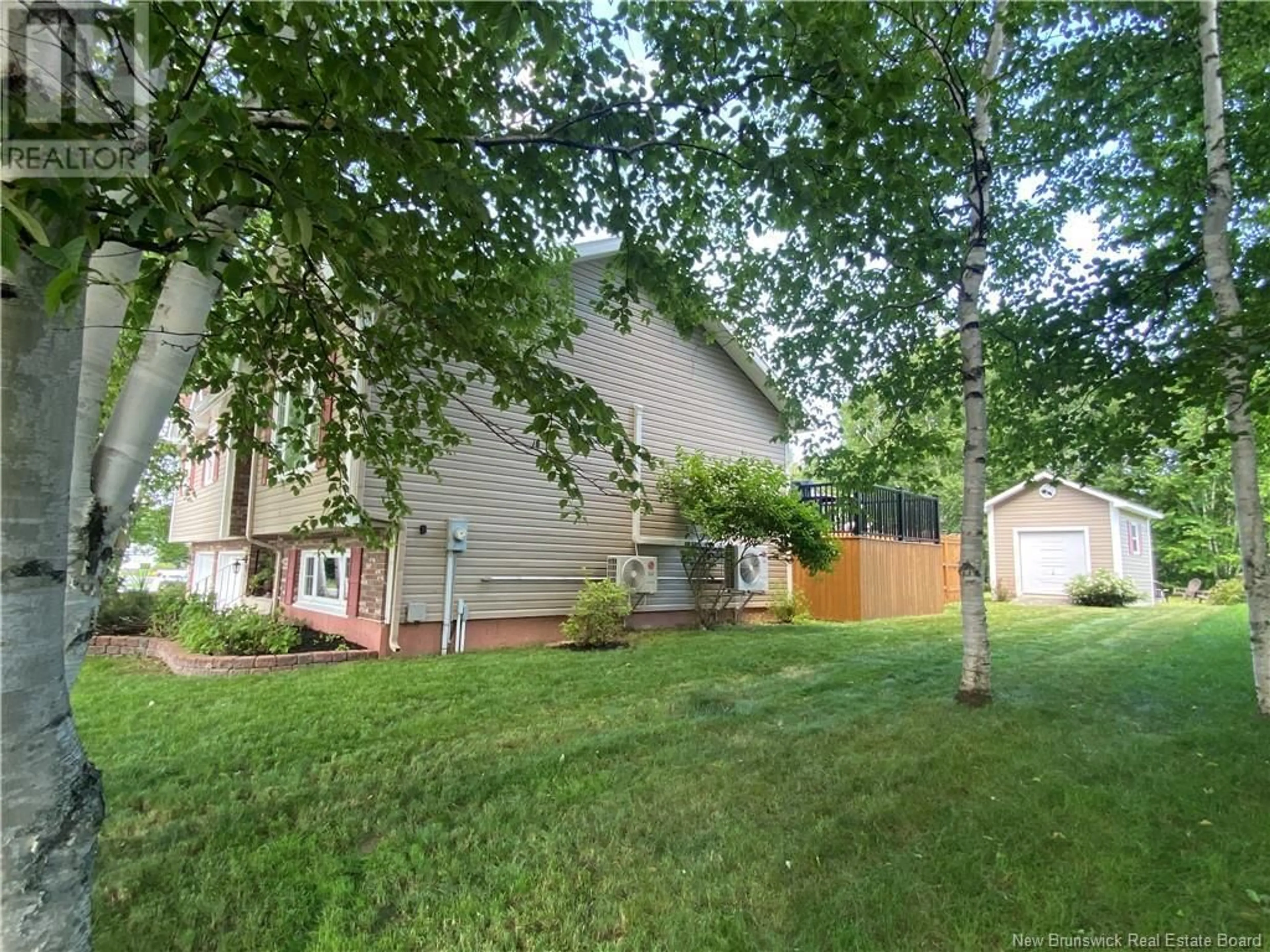 Frontside or backside of a home, the fenced backyard for 1060 Birchwood Drive, Bathurst New Brunswick E2A4W8