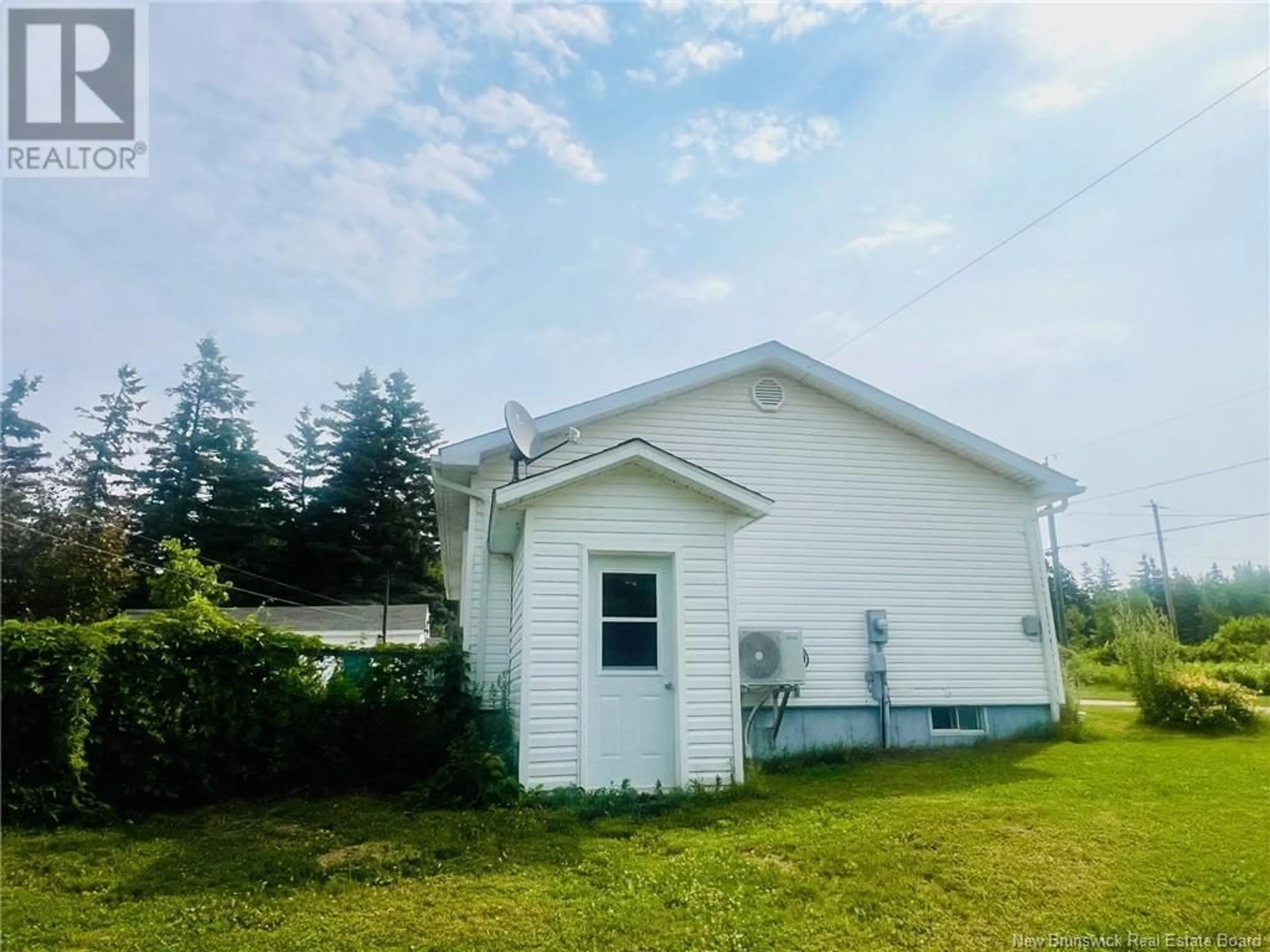 Frontside or backside of a home, the front or back of building for 94 Rue Acadie, Grande-Anse New Brunswick E8N1A2