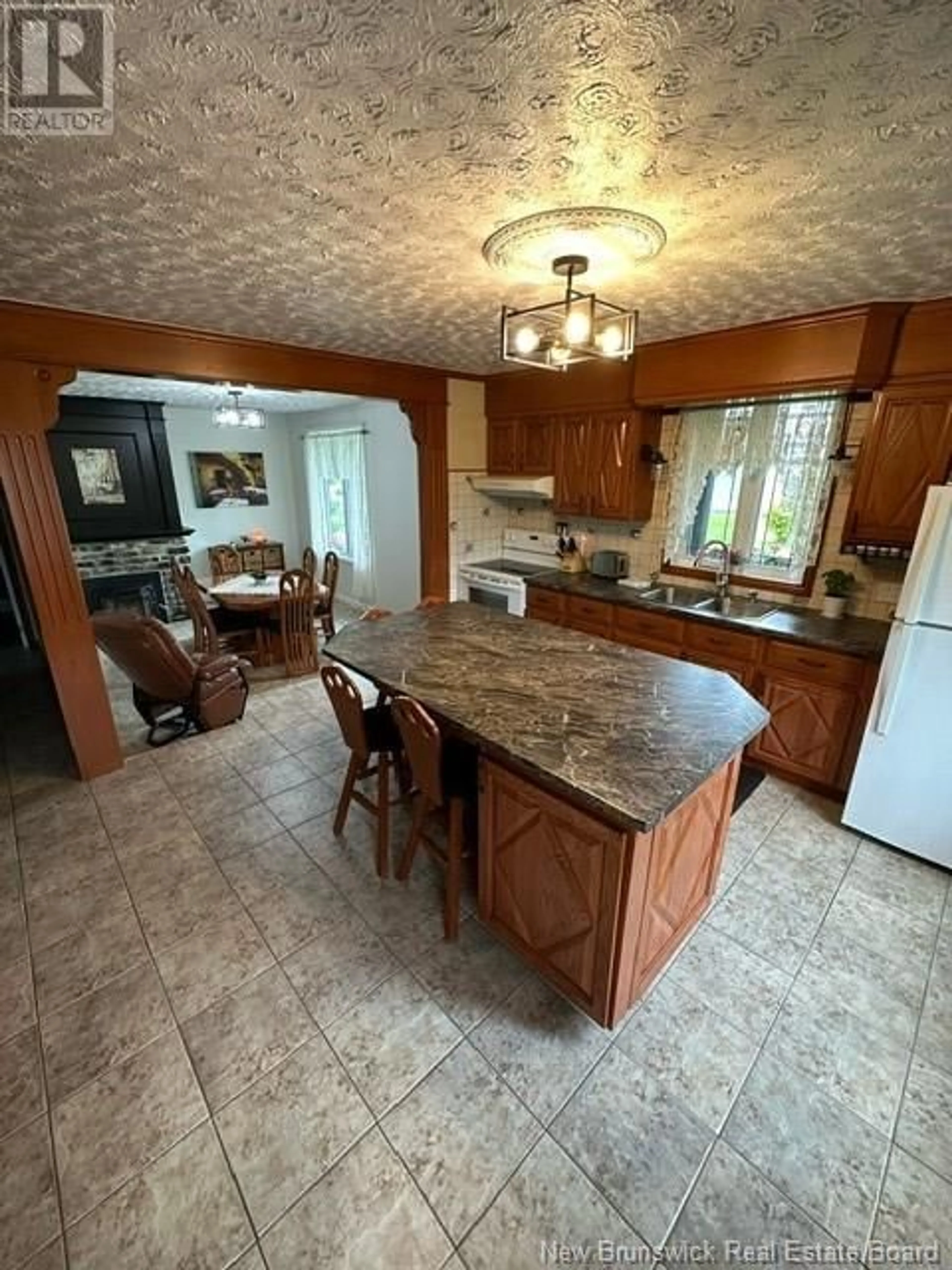 Open concept kitchen, ceramic/tile floor for 7082 ROUTE 17, Saint-Quentin New Brunswick E8A2J4