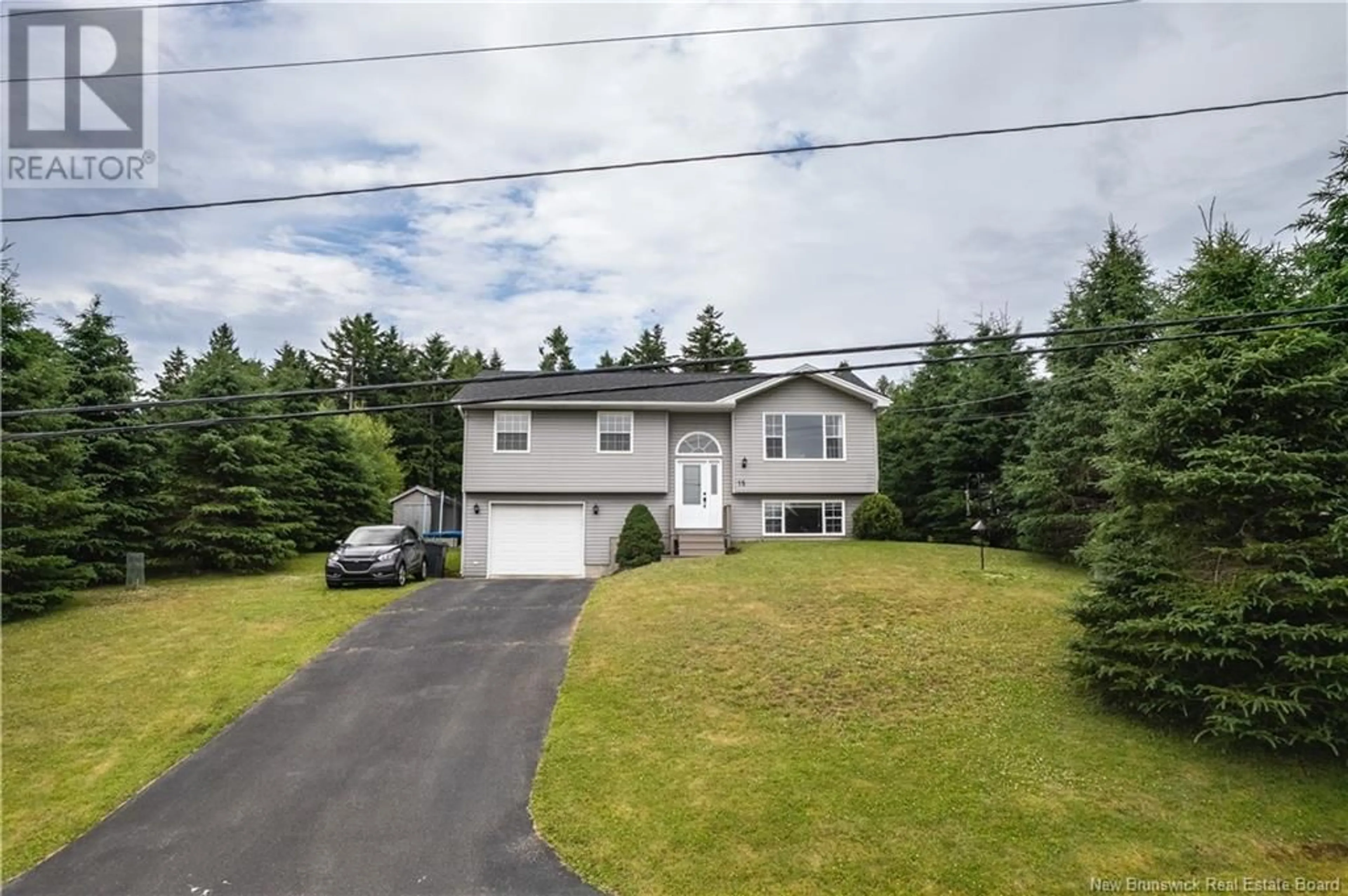 Frontside or backside of a home for 15 Teslin Drive, Quispamsis New Brunswick E2E6B9