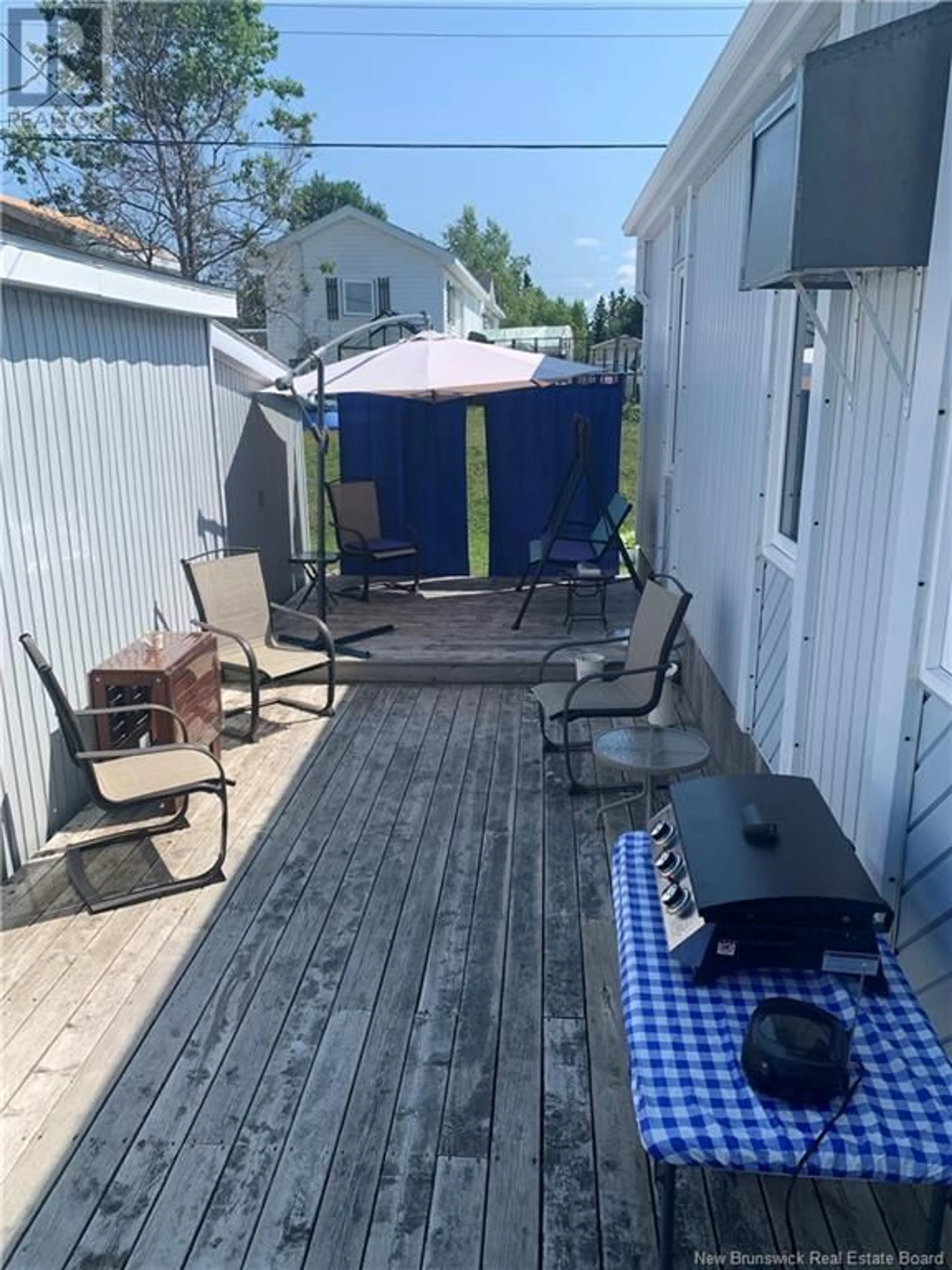 Patio, the fenced backyard for 6 2E AV DU PARC, Caraquet New Brunswick E1W1A7