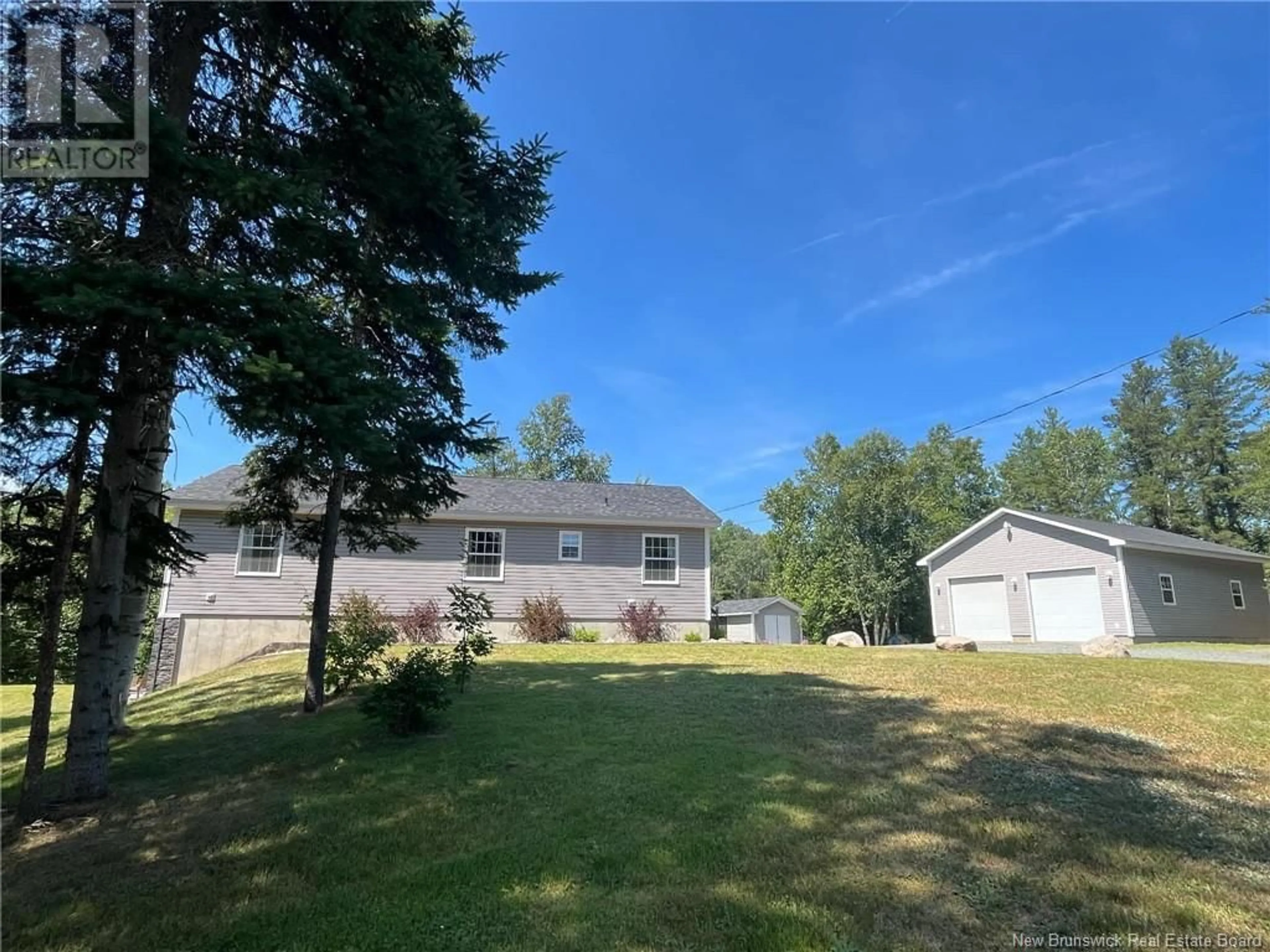 Frontside or backside of a home, the fenced backyard for 1959 Northwest Road, Sevogle New Brunswick E9E1M8