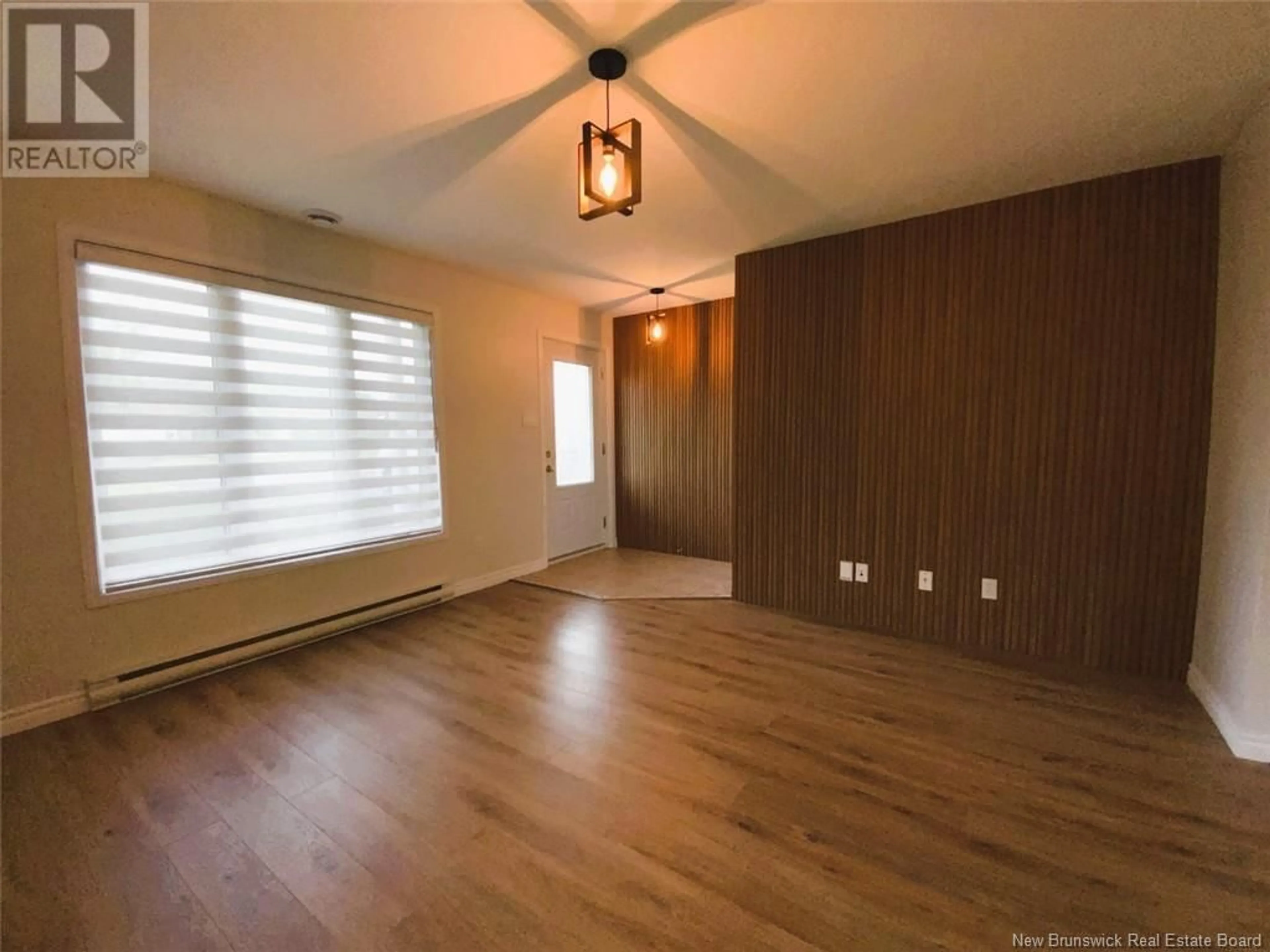 A pic of a room, wood floors for 44 Perron Street, Edmundston New Brunswick E3V5C6