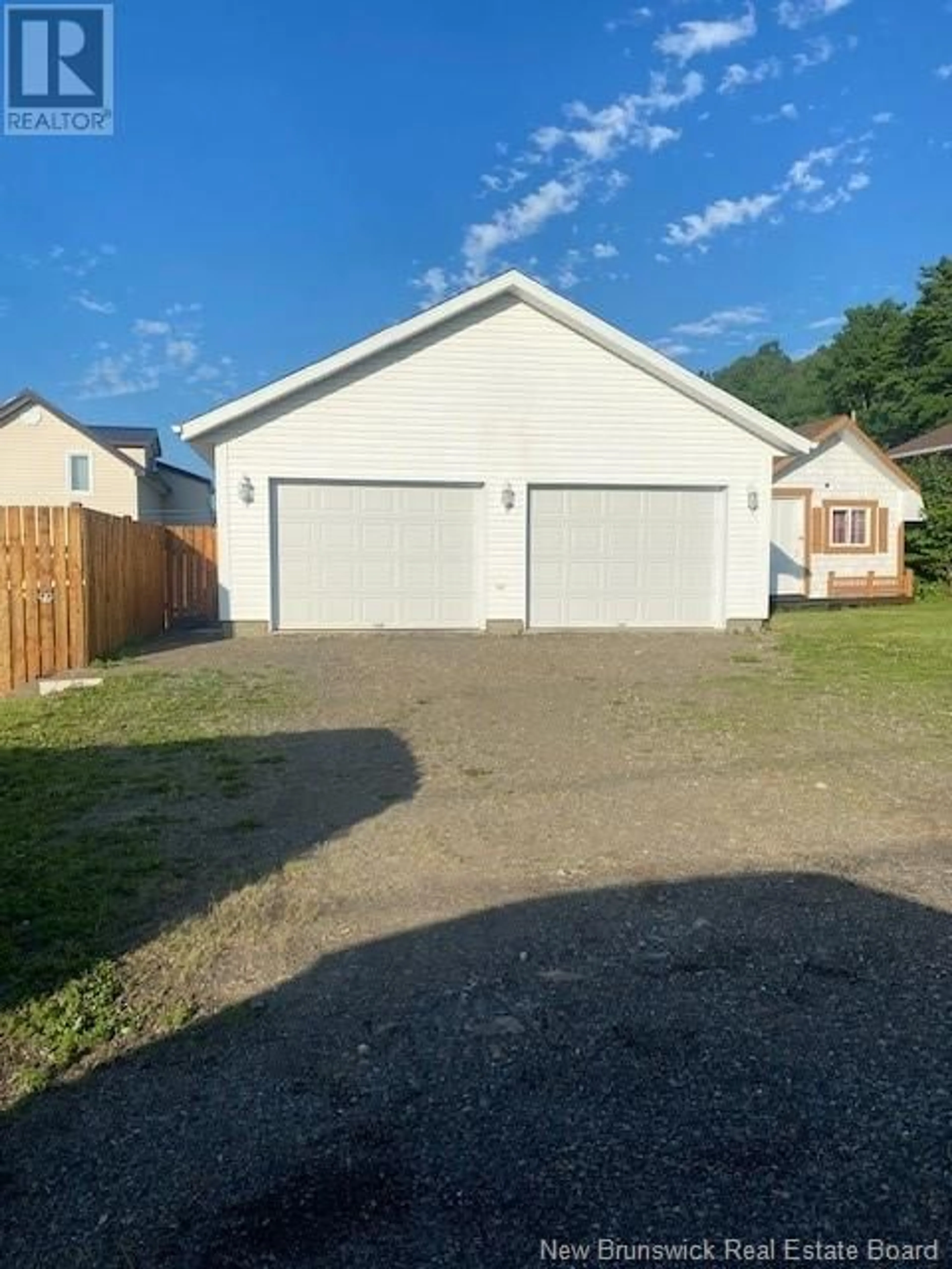 Frontside or backside of a home, the fenced backyard for 448 Vanier Street, Campbellton New Brunswick E3N1V7