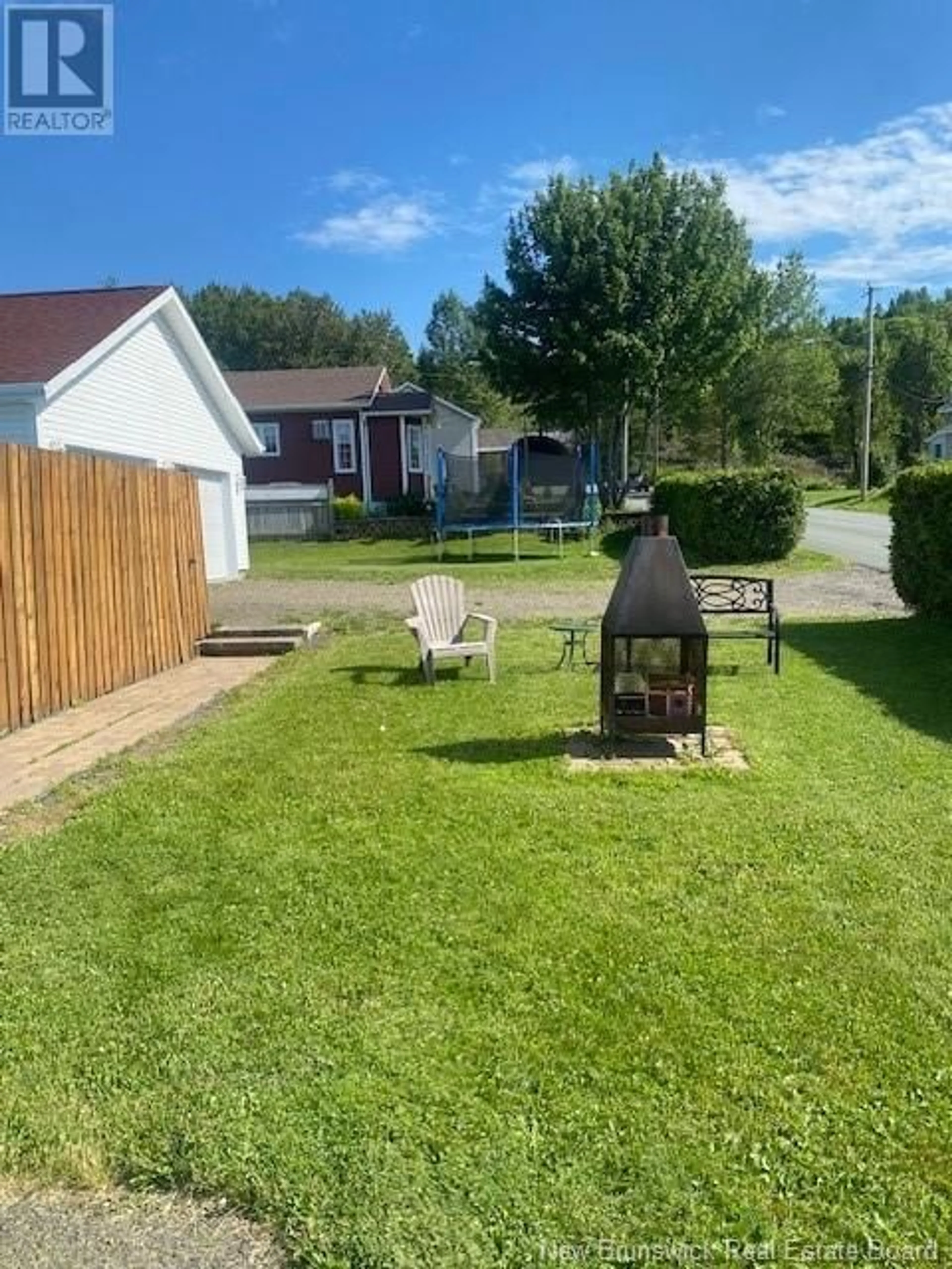 Frontside or backside of a home, the fenced backyard for 448 Vanier Street, Campbellton New Brunswick E3N1V7