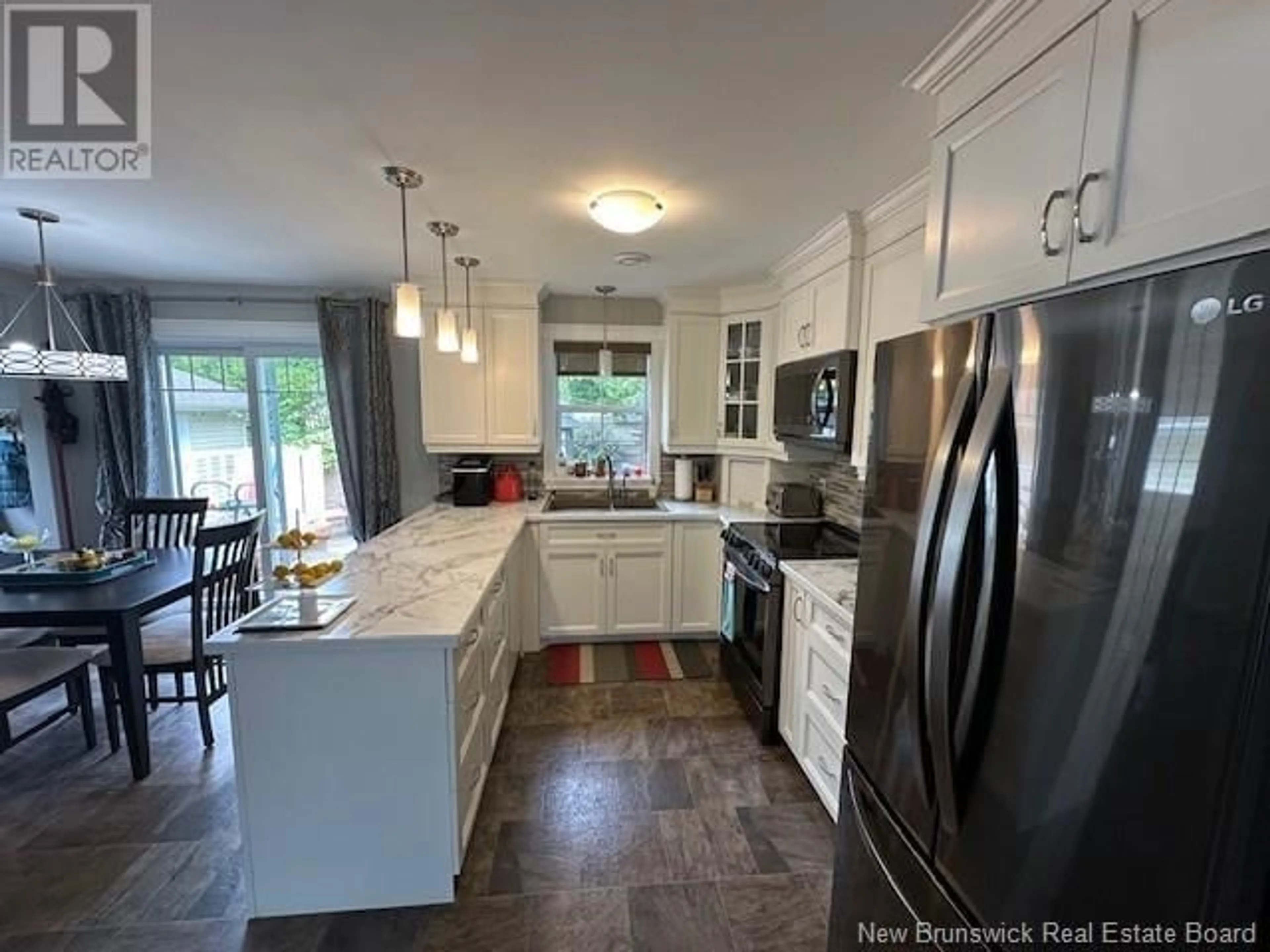 Open concept kitchen for 55 Duncan Street, Tide Head New Brunswick E3N4M5