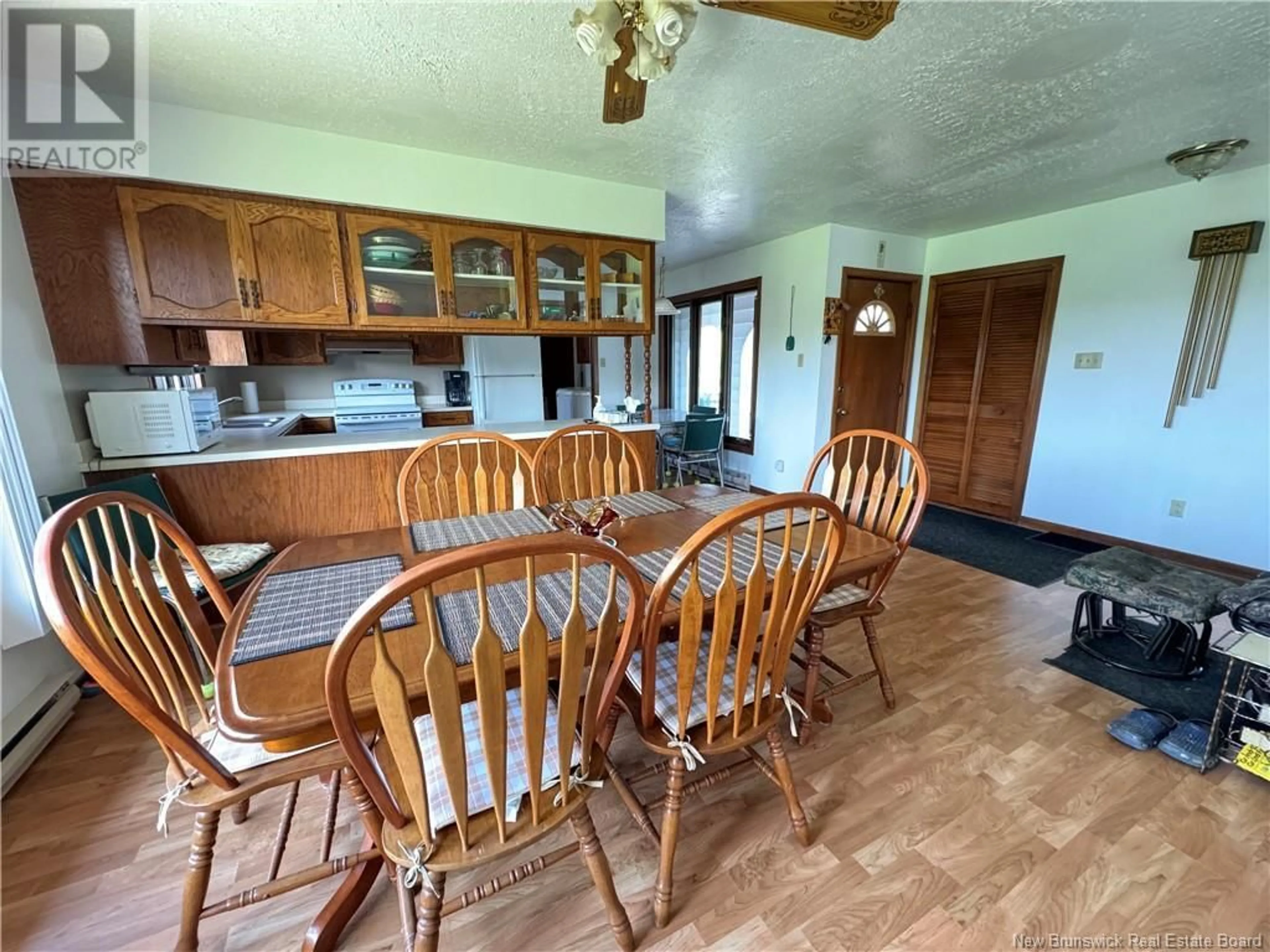 Dining room, wood floors, cottage for 10040 144 Route, Saint-André New Brunswick E3Y3J2