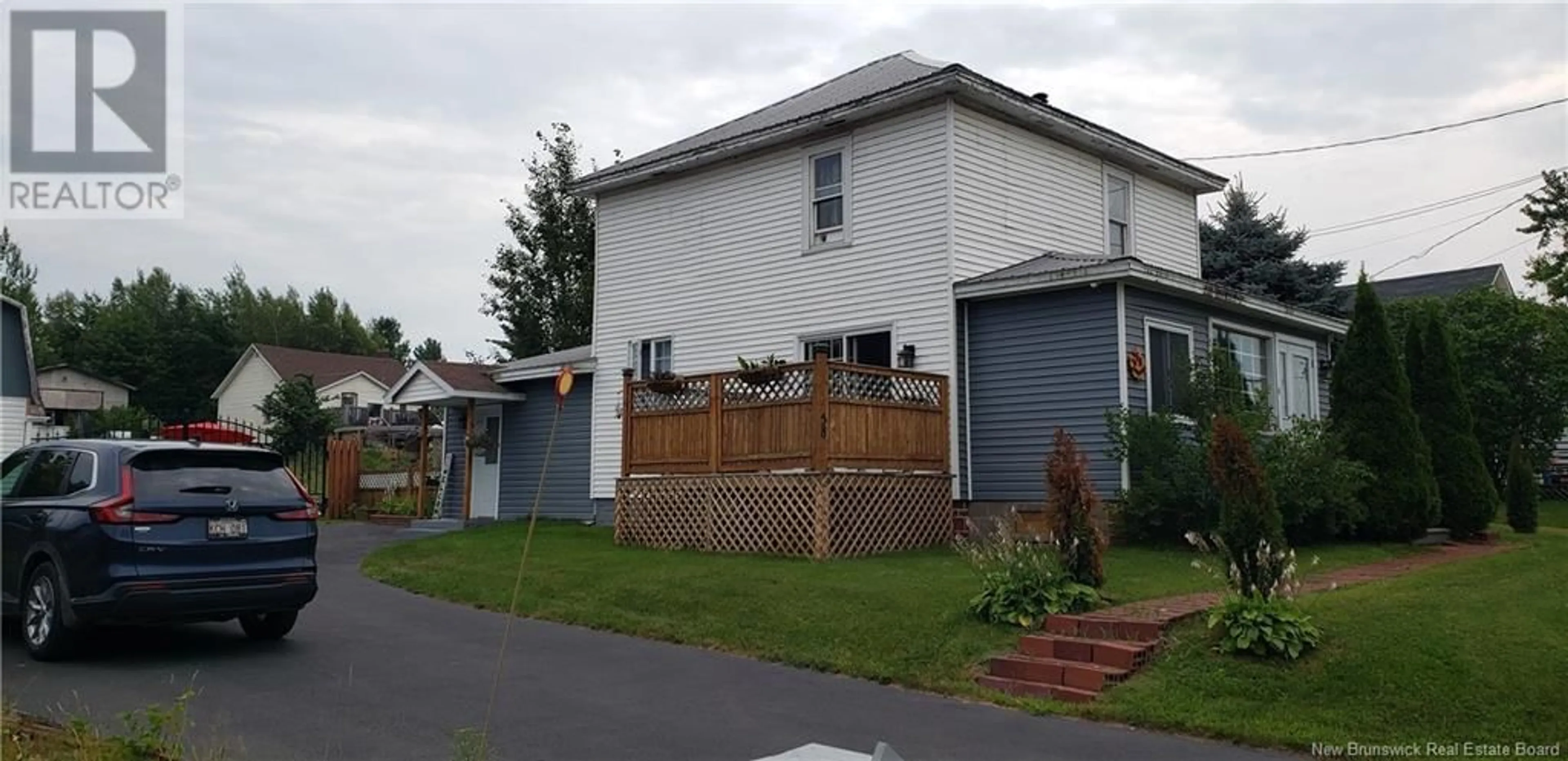 Frontside or backside of a home, the fenced backyard for 58 McLeod Avenue, Chipman New Brunswick E4A2B8