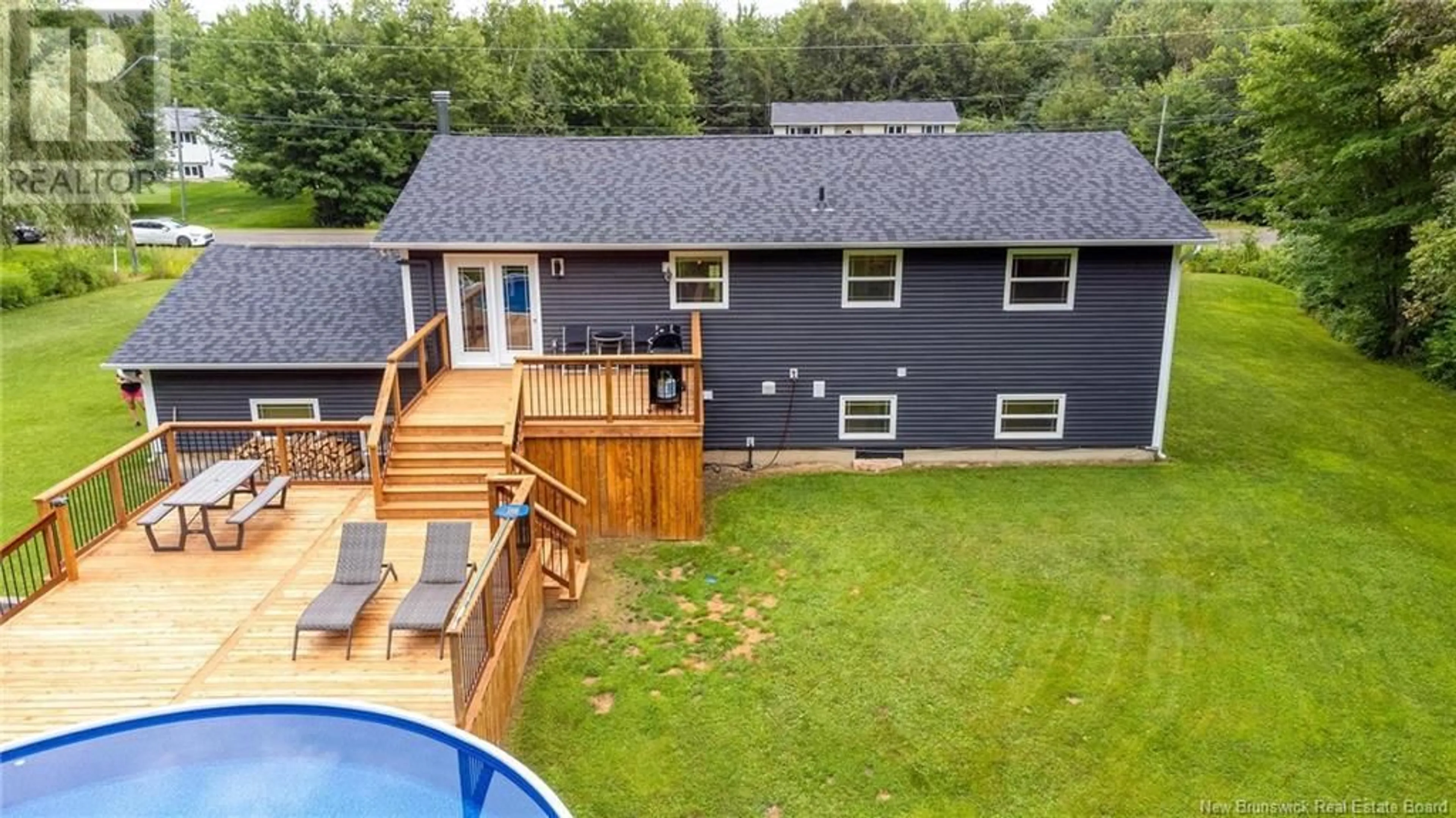 Frontside or backside of a home, the fenced backyard for 107 Camber Drive, Hanwell New Brunswick E3C2J6