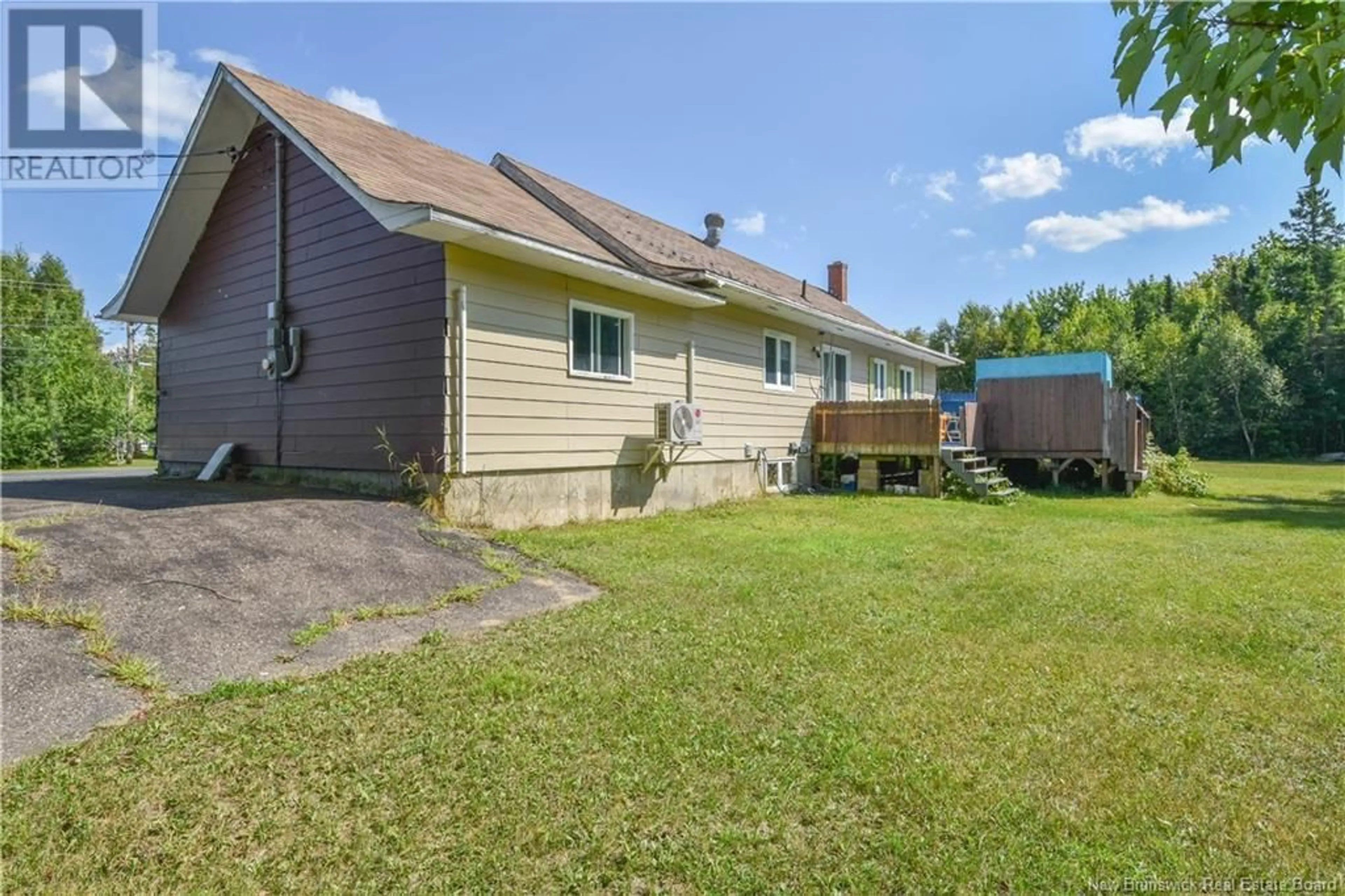 Frontside or backside of a home, the fenced backyard for 564 Saint-Joseph Boulevard, Saint-Léolin New Brunswick E8N2N1