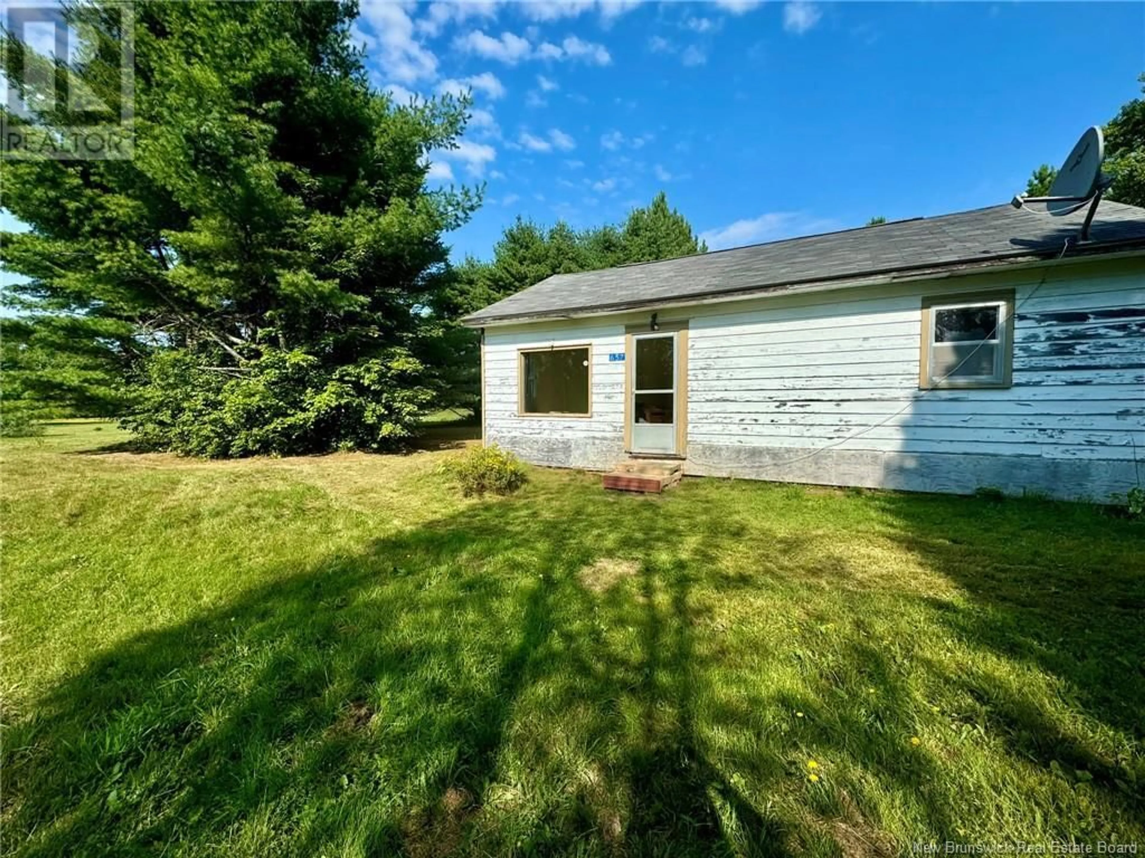 Frontside or backside of a home, the fenced backyard for 657 Oldfield Road, Miramichi New Brunswick E1V6K8