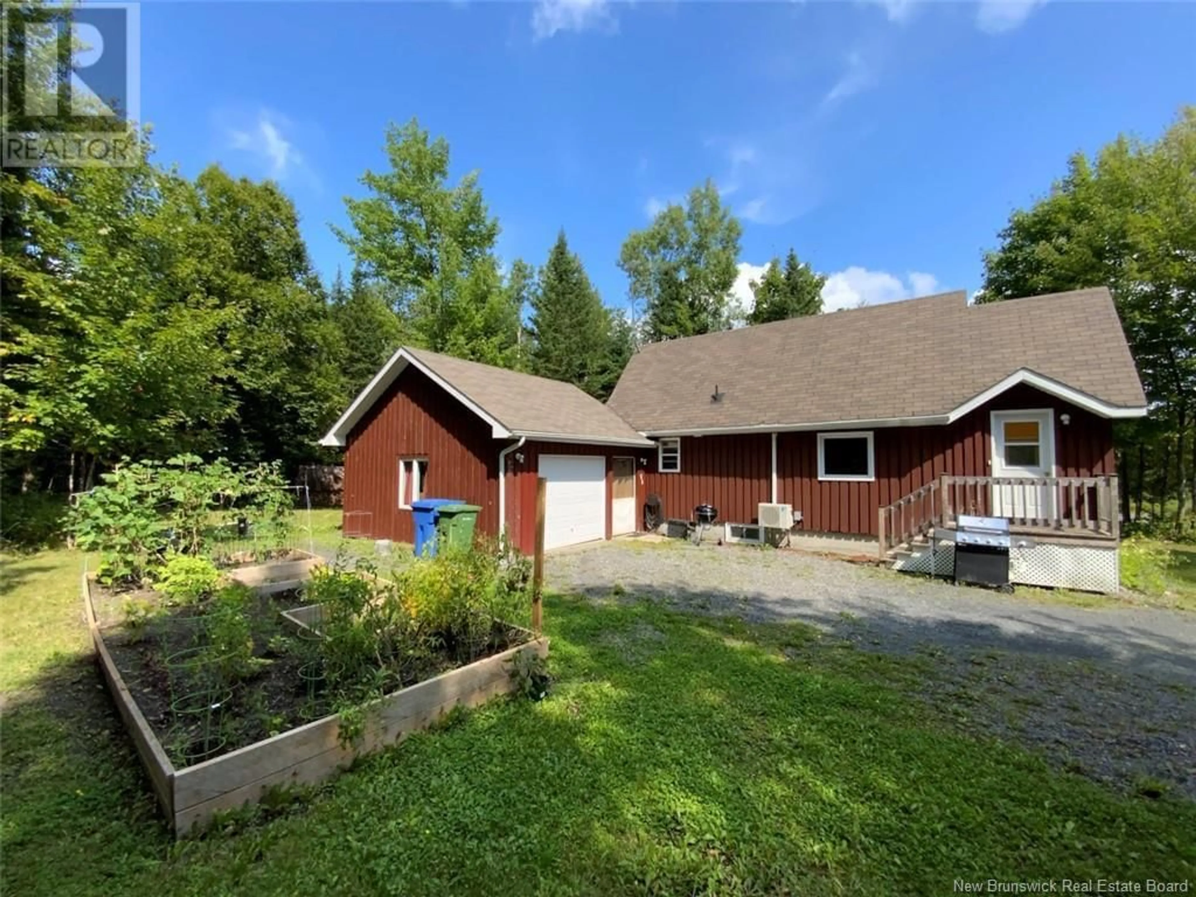 Frontside or backside of a home, the fenced backyard for 25 Old Power Road, Saint-Joseph-De-Madawaska New Brunswick E7B2L7