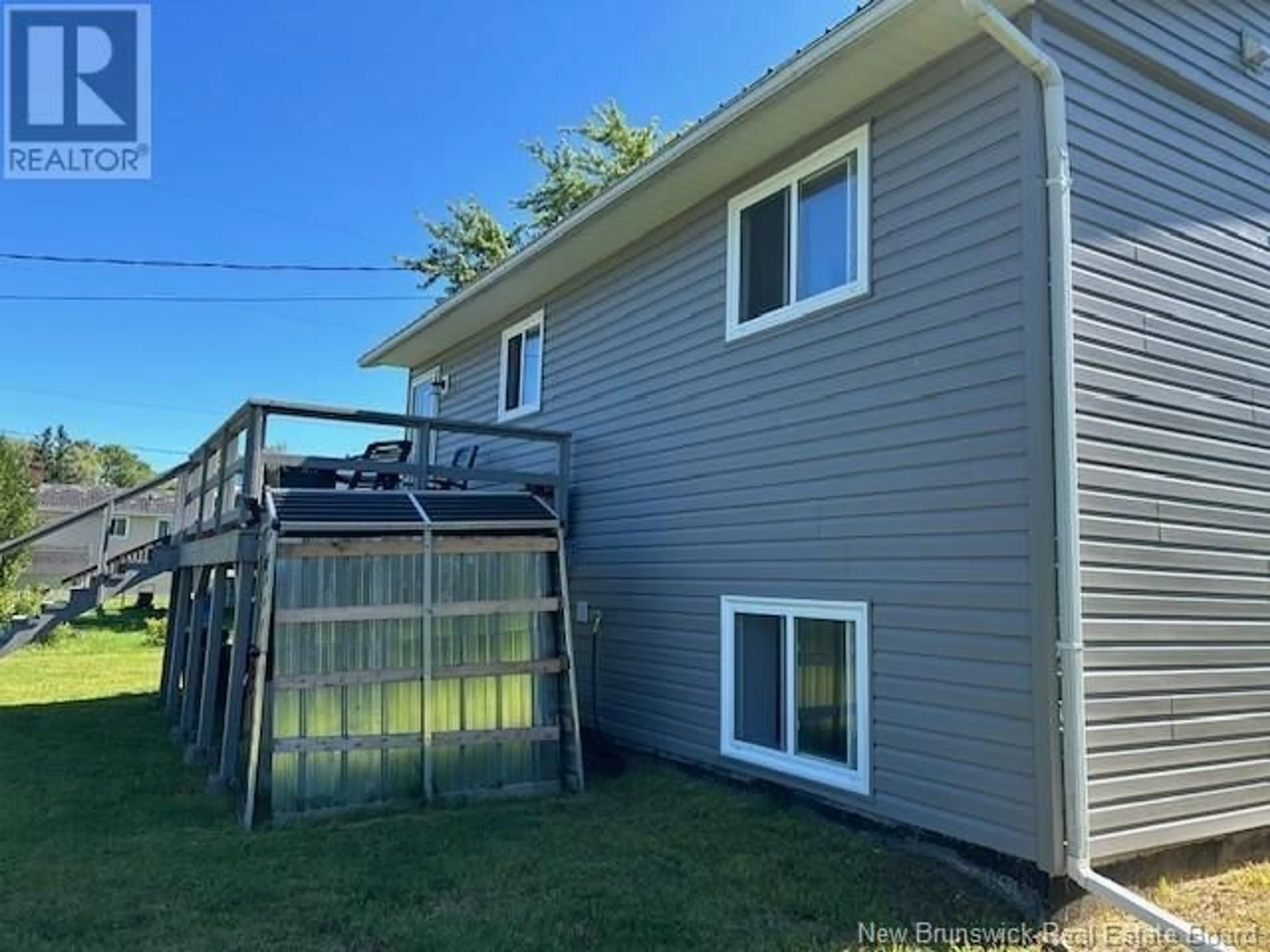 Frontside or backside of a home, the fenced backyard for 3 Oaksway, St. Stephen New Brunswick E3L1P8