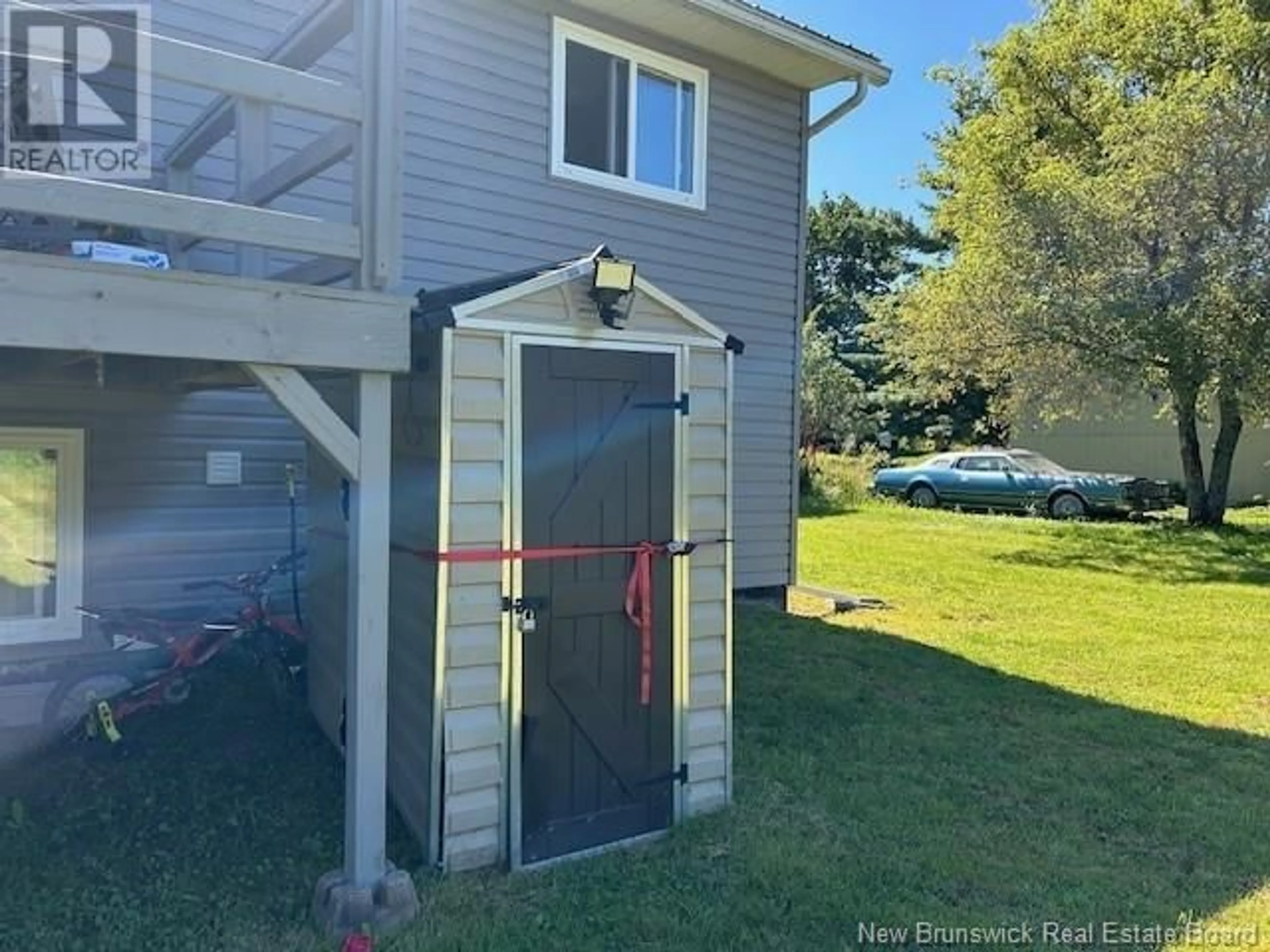 A pic from exterior of the house or condo, the fenced backyard for 3 Oaksway, St. Stephen New Brunswick E3L1P8