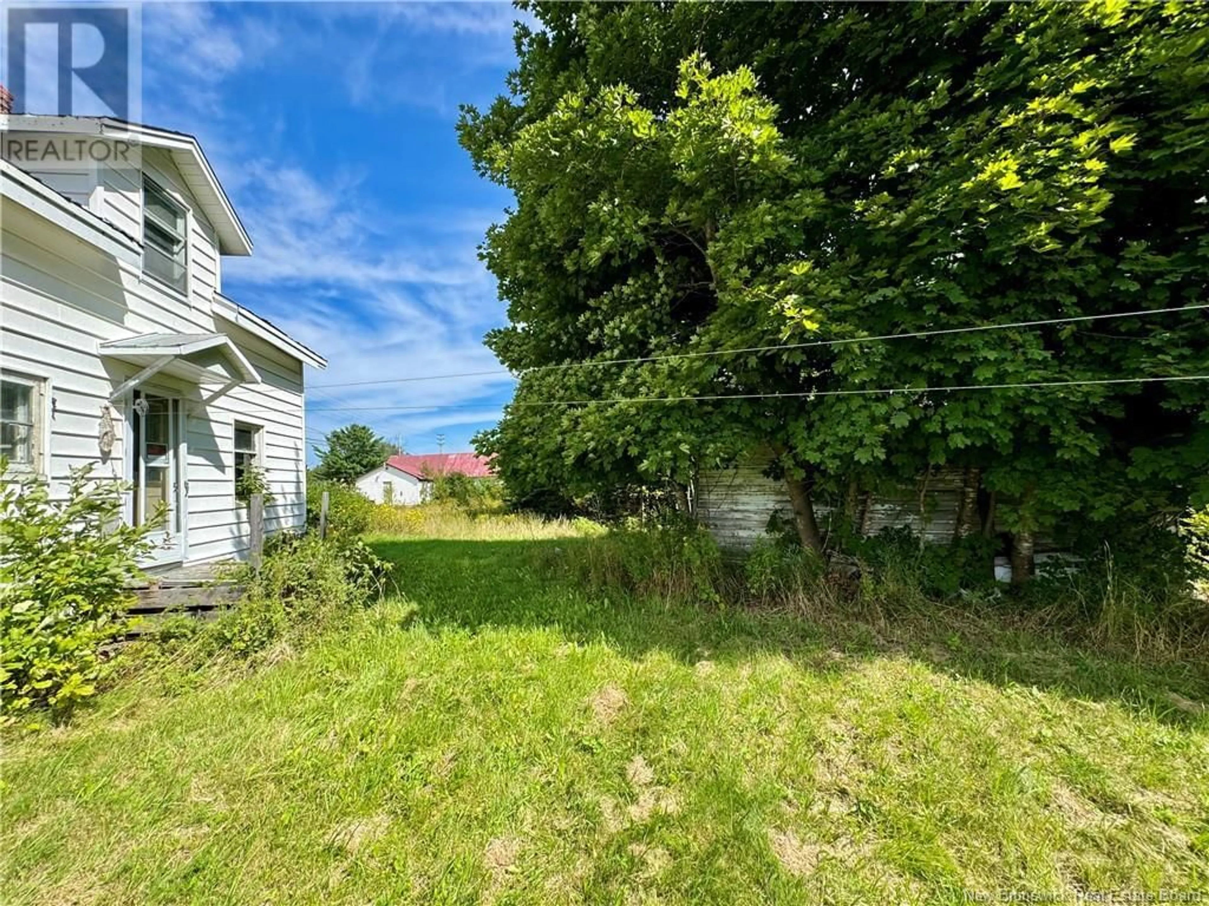 Frontside or backside of a home, the fenced backyard for 1755 Route 425, Sunny Corner New Brunswick E9E1J1