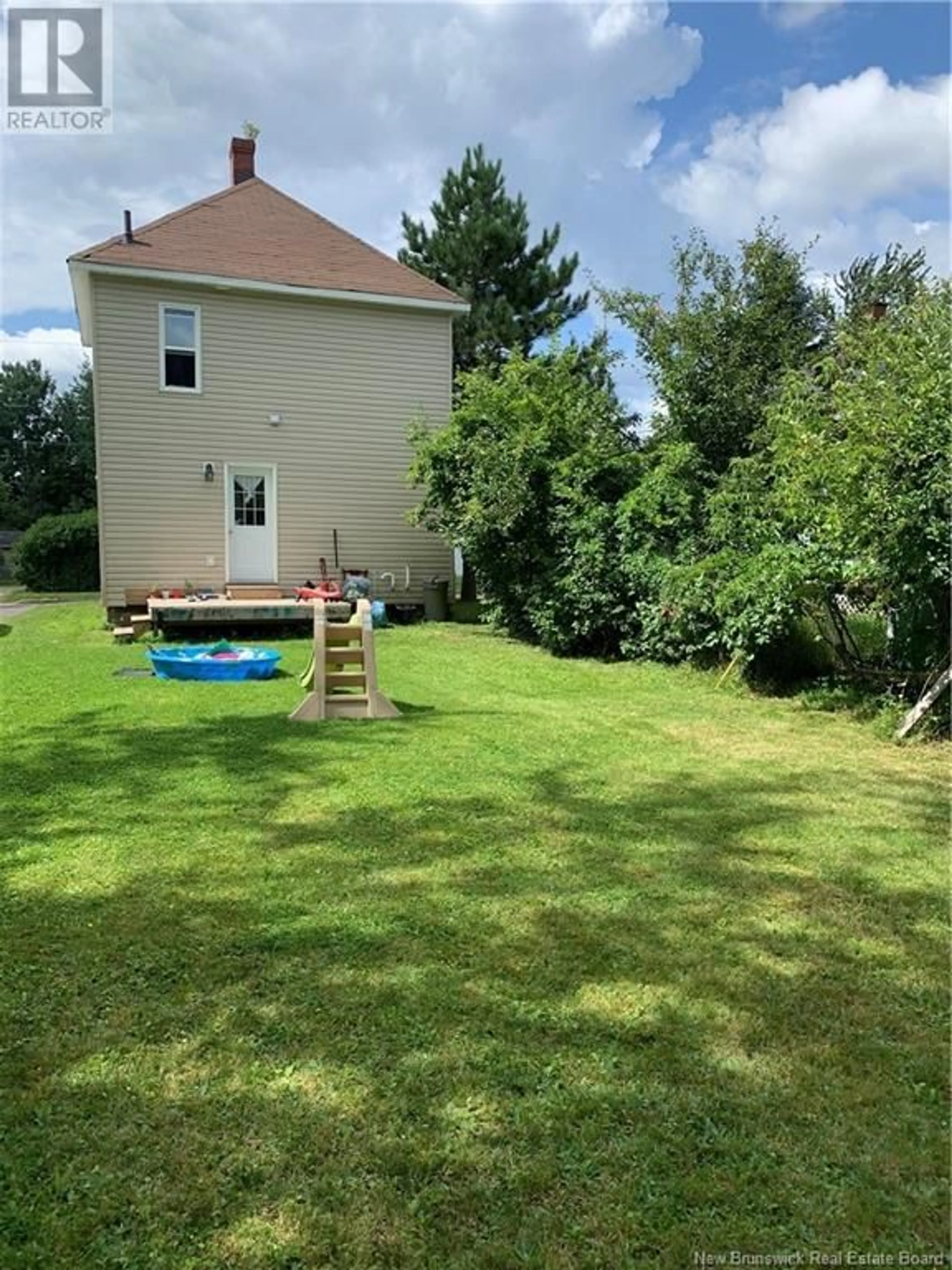 Frontside or backside of a home, the fenced backyard for 45 Seventh Street, Moncton New Brunswick E1E3G3