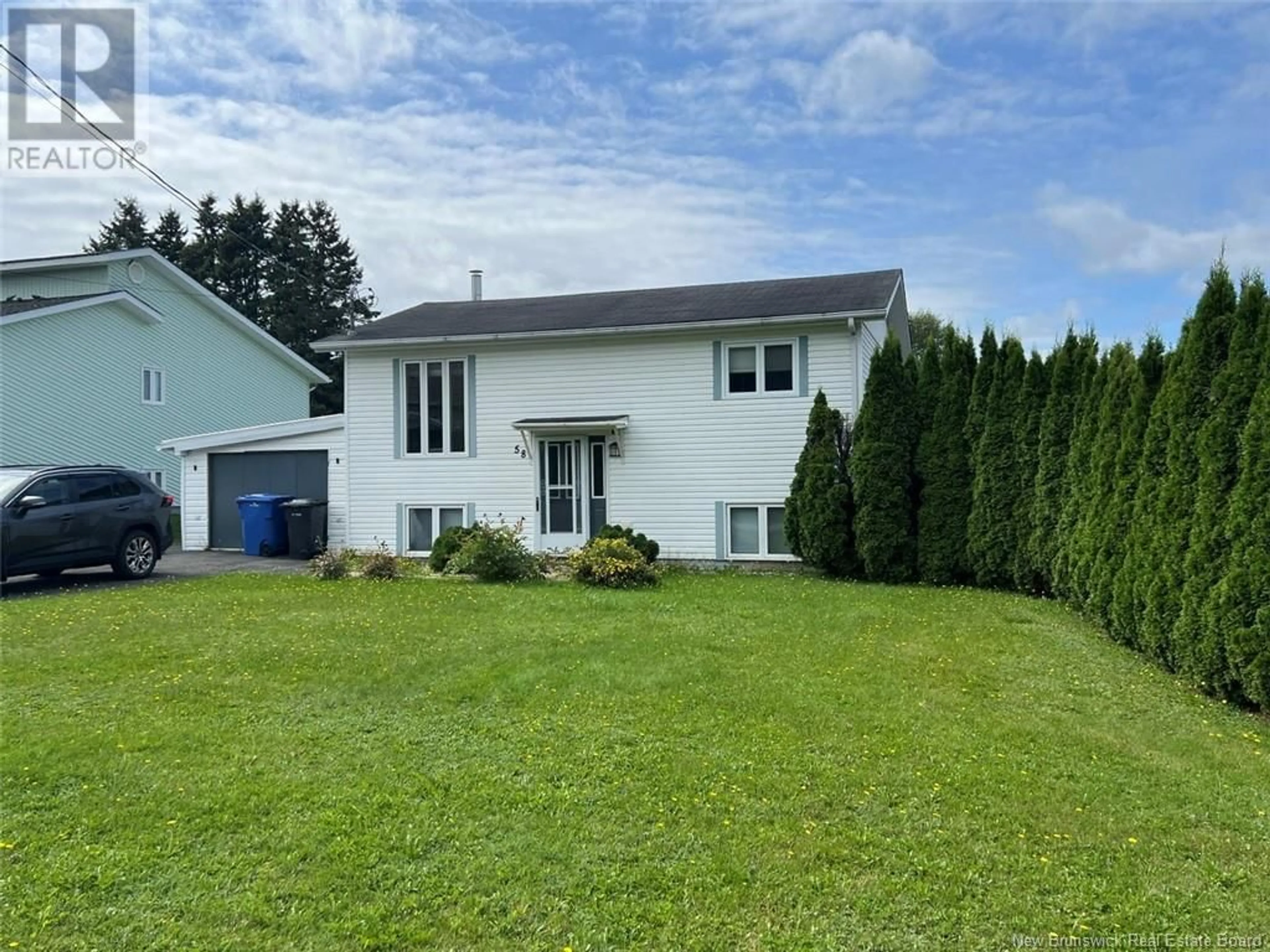 Frontside or backside of a home, the fenced backyard for 58 St-Joseph Street, Sainte-Anne-De-Madawaska New Brunswick E7E1L3