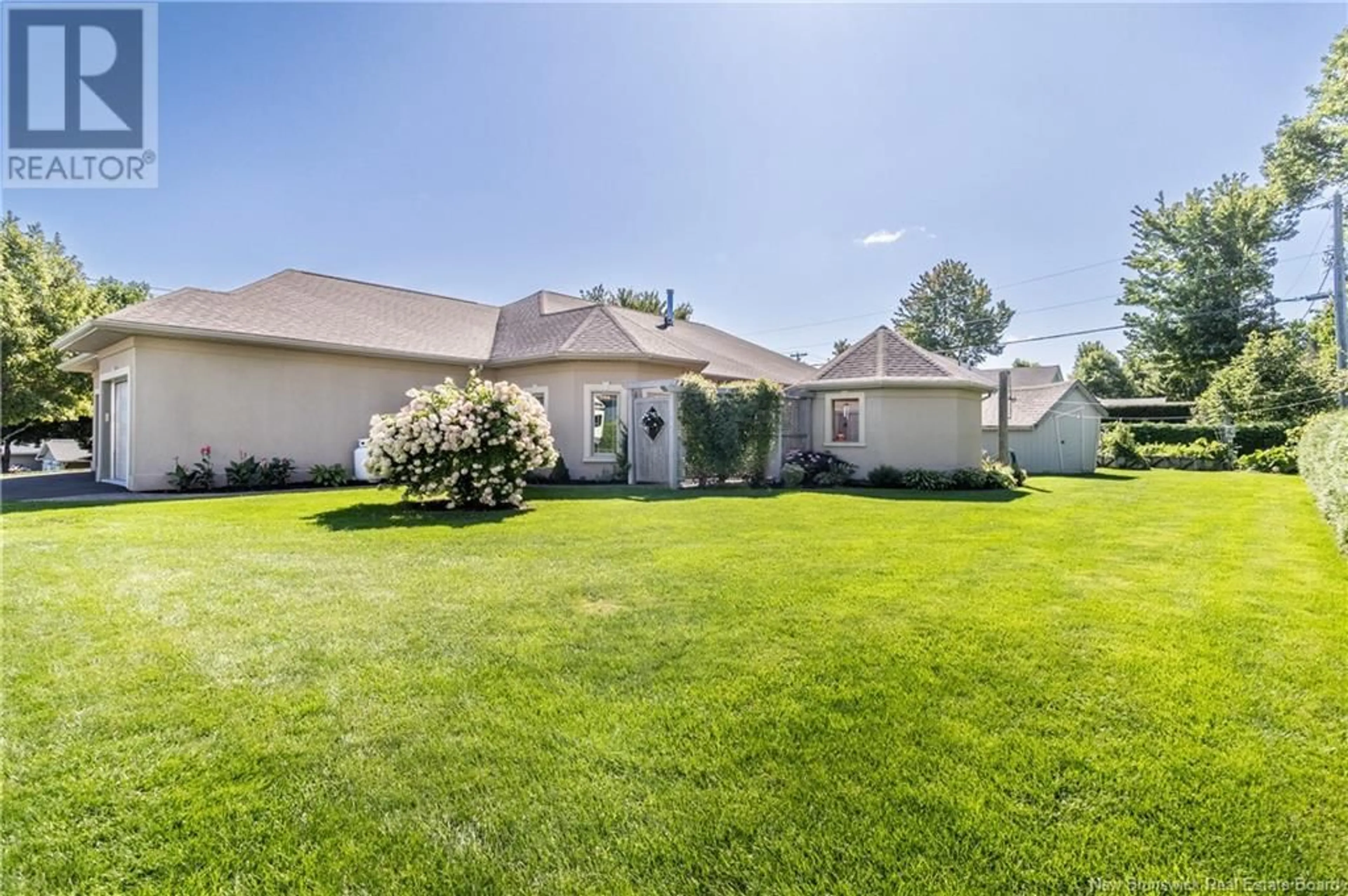 Frontside or backside of a home, the fenced backyard for 131 Creighton Street North, Woodstock New Brunswick E7M1N3