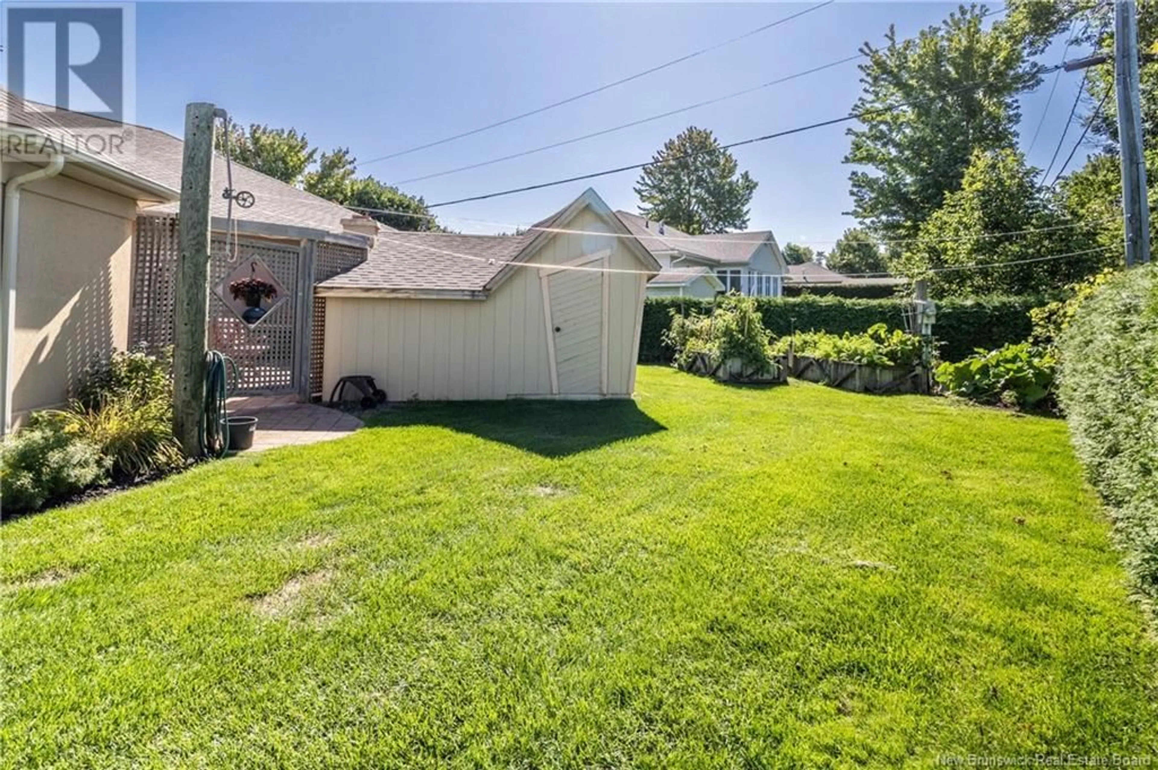 Frontside or backside of a home, the fenced backyard for 131 Creighton Street North, Woodstock New Brunswick E7M1N3