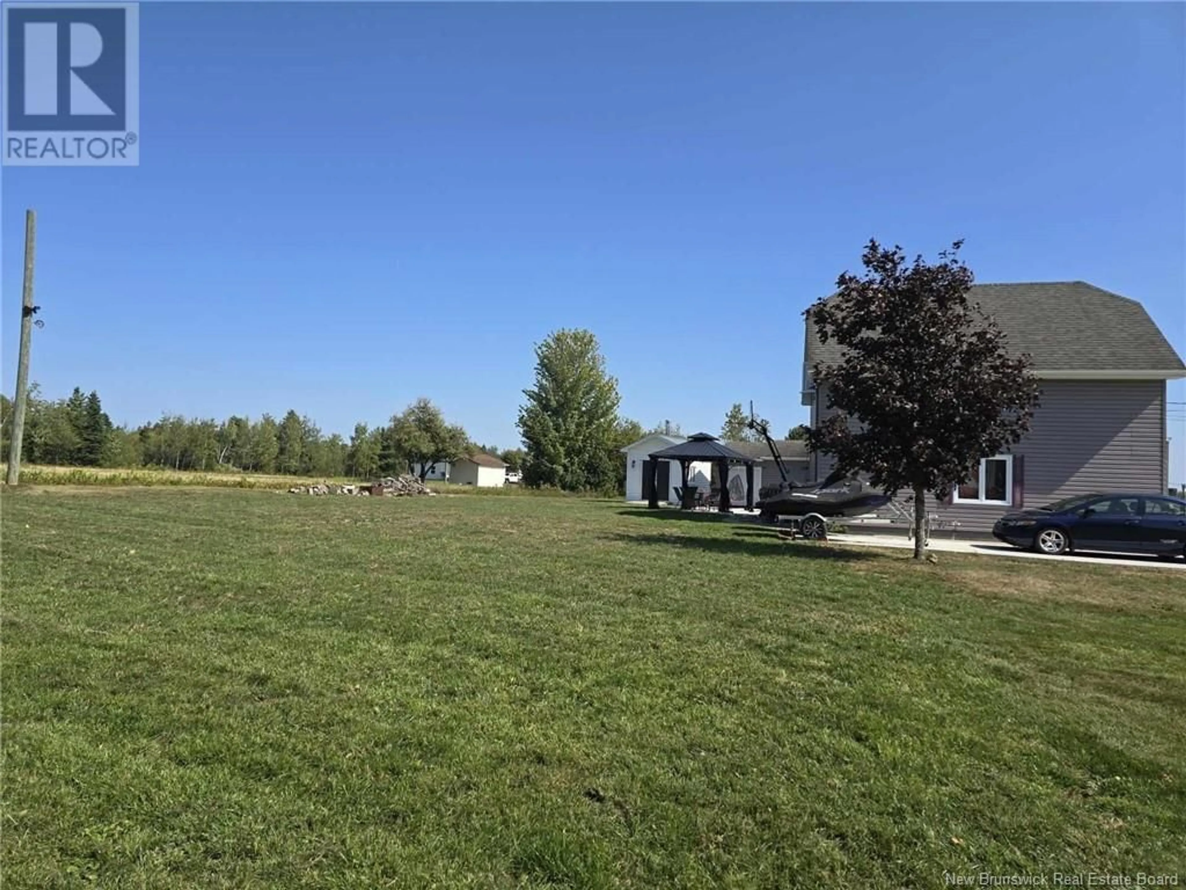 Frontside or backside of a home, the fenced backyard for 158 Fairisle, Neguac New Brunswick E9G1E6