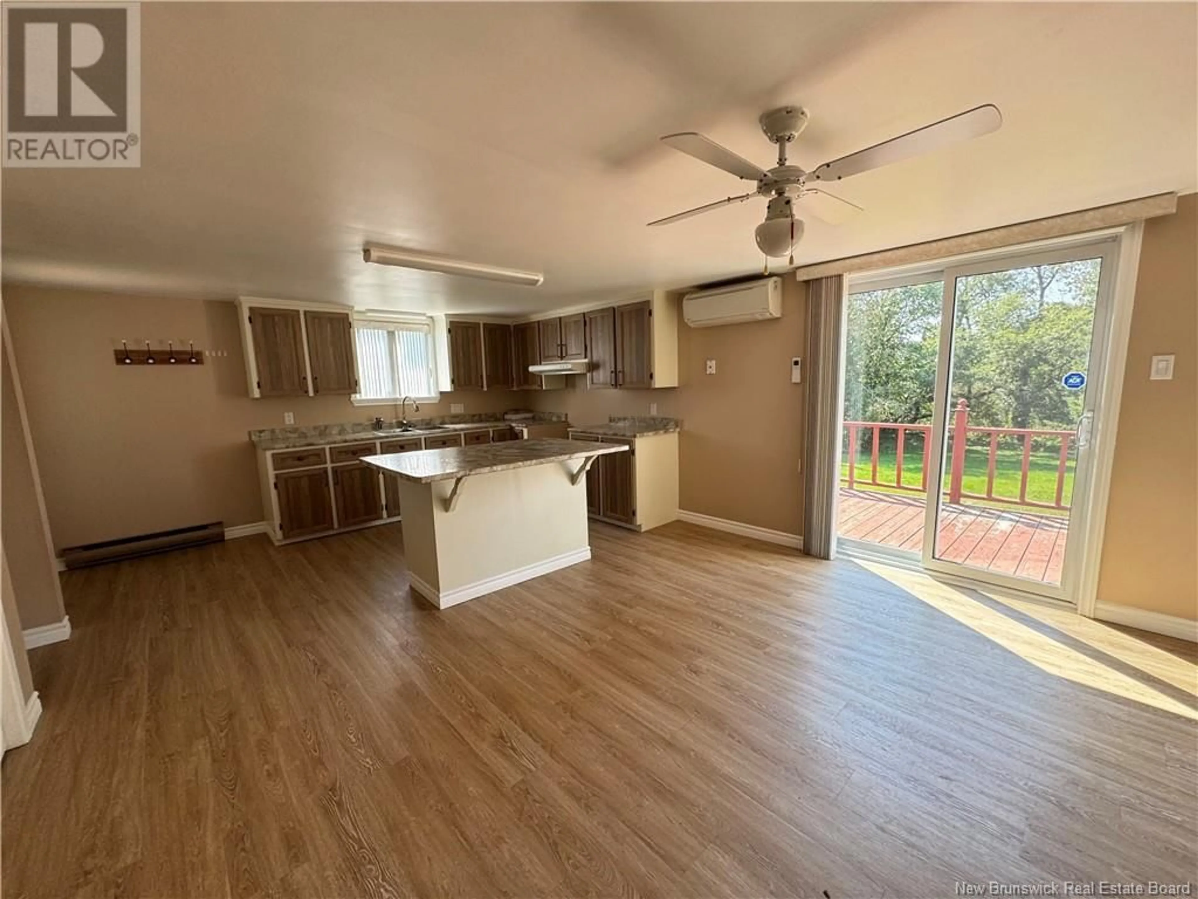 Open concept kitchen, wood/laminate floor for 83 COURT STREET, Grand-Sault/Grand Falls New Brunswick E3Z2P6