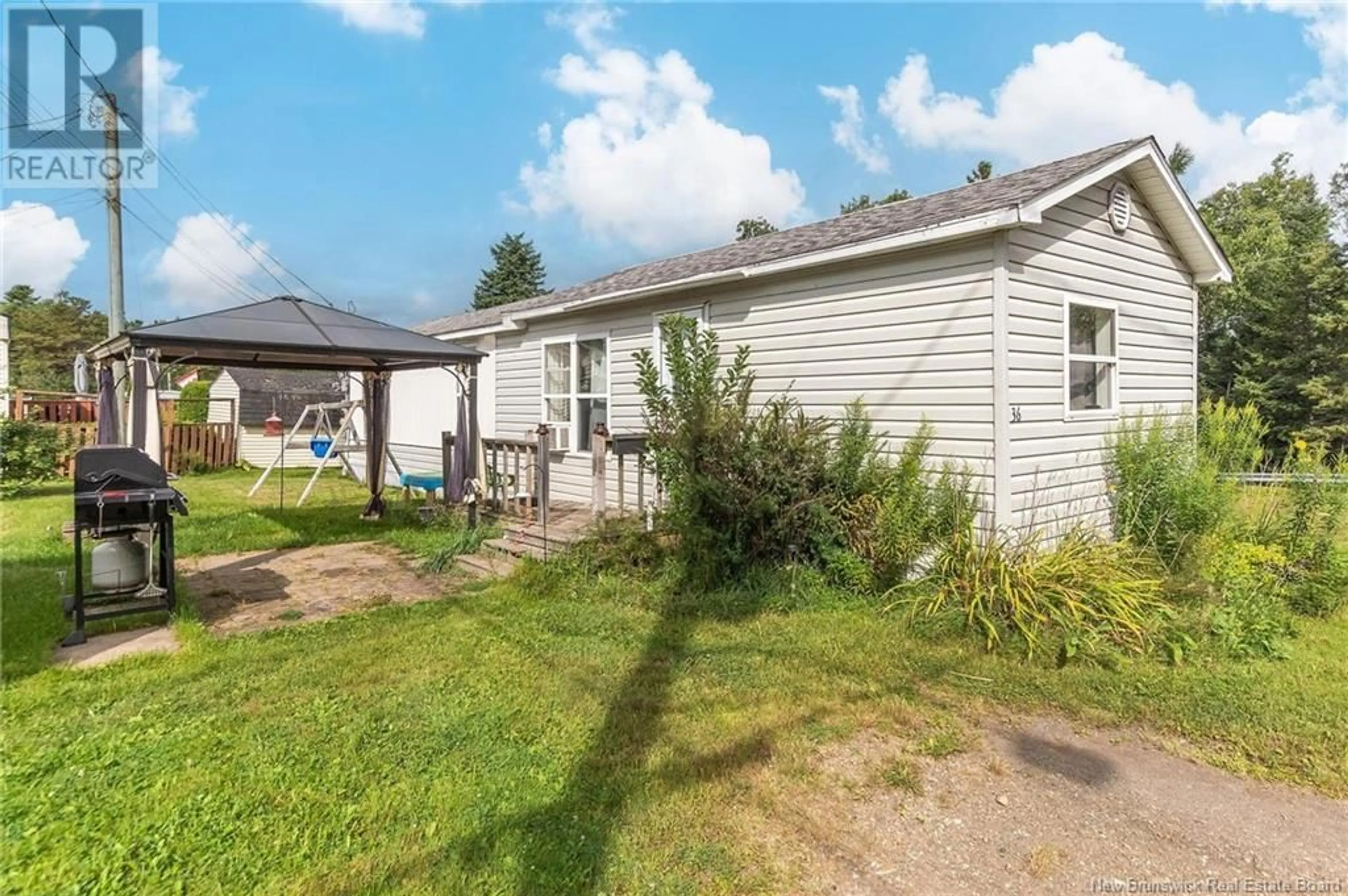 Frontside or backside of a home, the fenced backyard for 36 Cascade Avenue, Lakeview New Brunswick E1E2J7