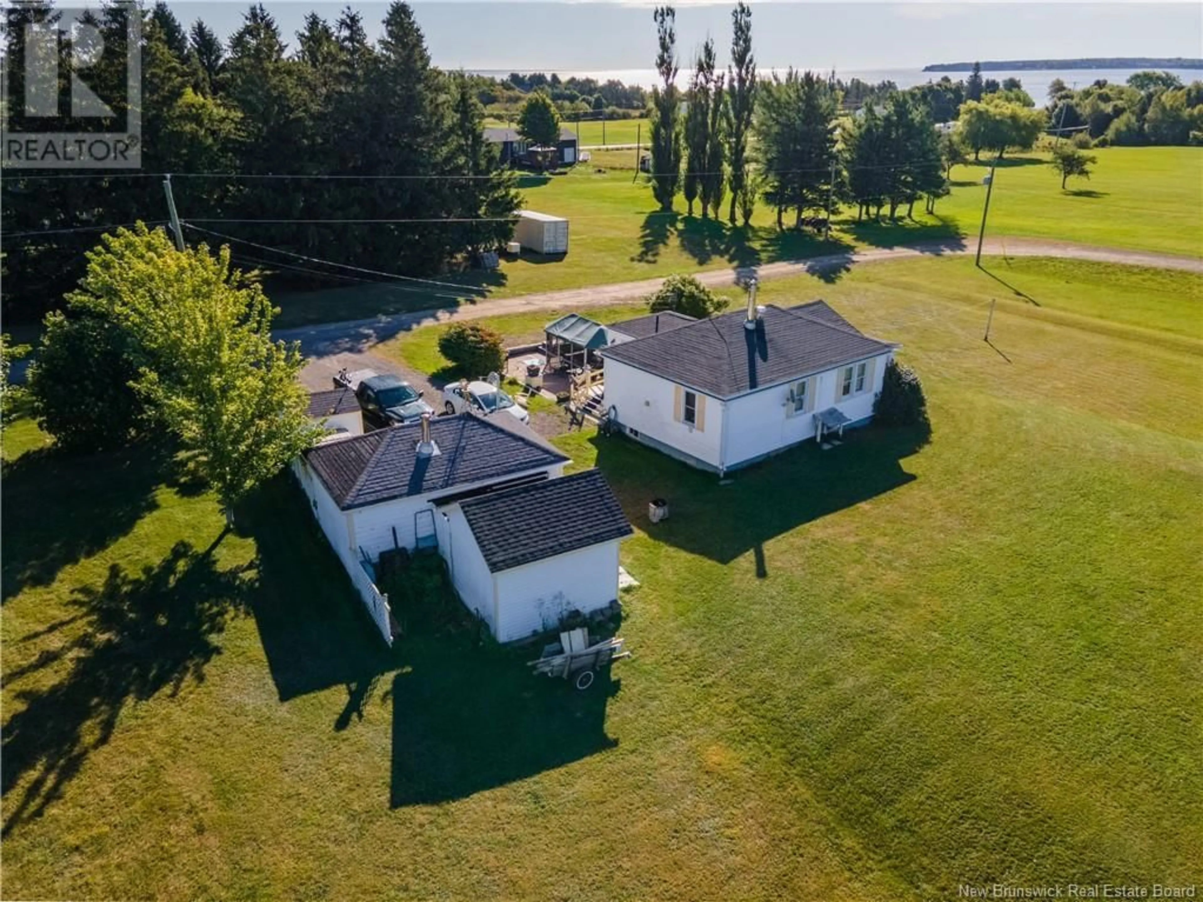 Frontside or backside of a home, the fenced backyard for 107 Chemin Des Roches, Bouctouche New Brunswick E4S4L9