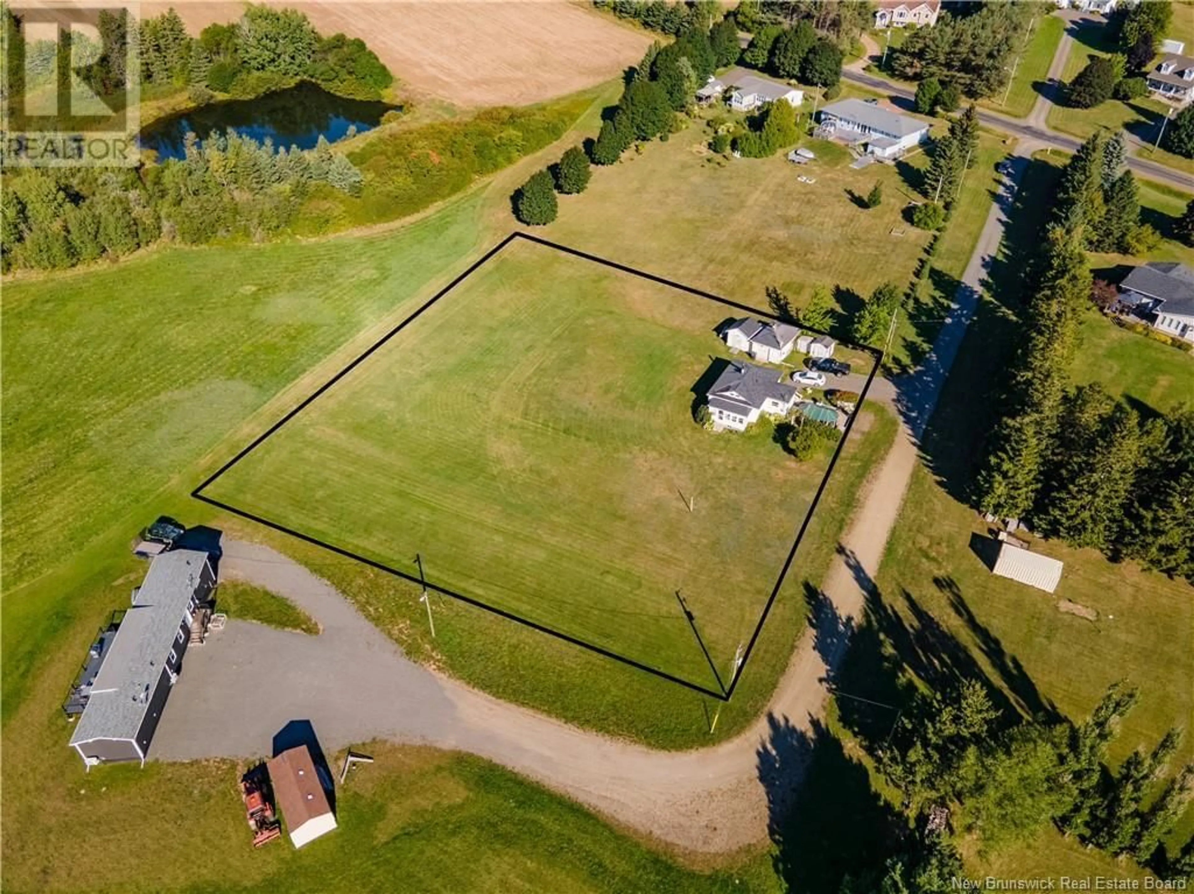 Frontside or backside of a home, the fenced backyard for 107 Chemin Des Roches, Bouctouche New Brunswick E4S4L9