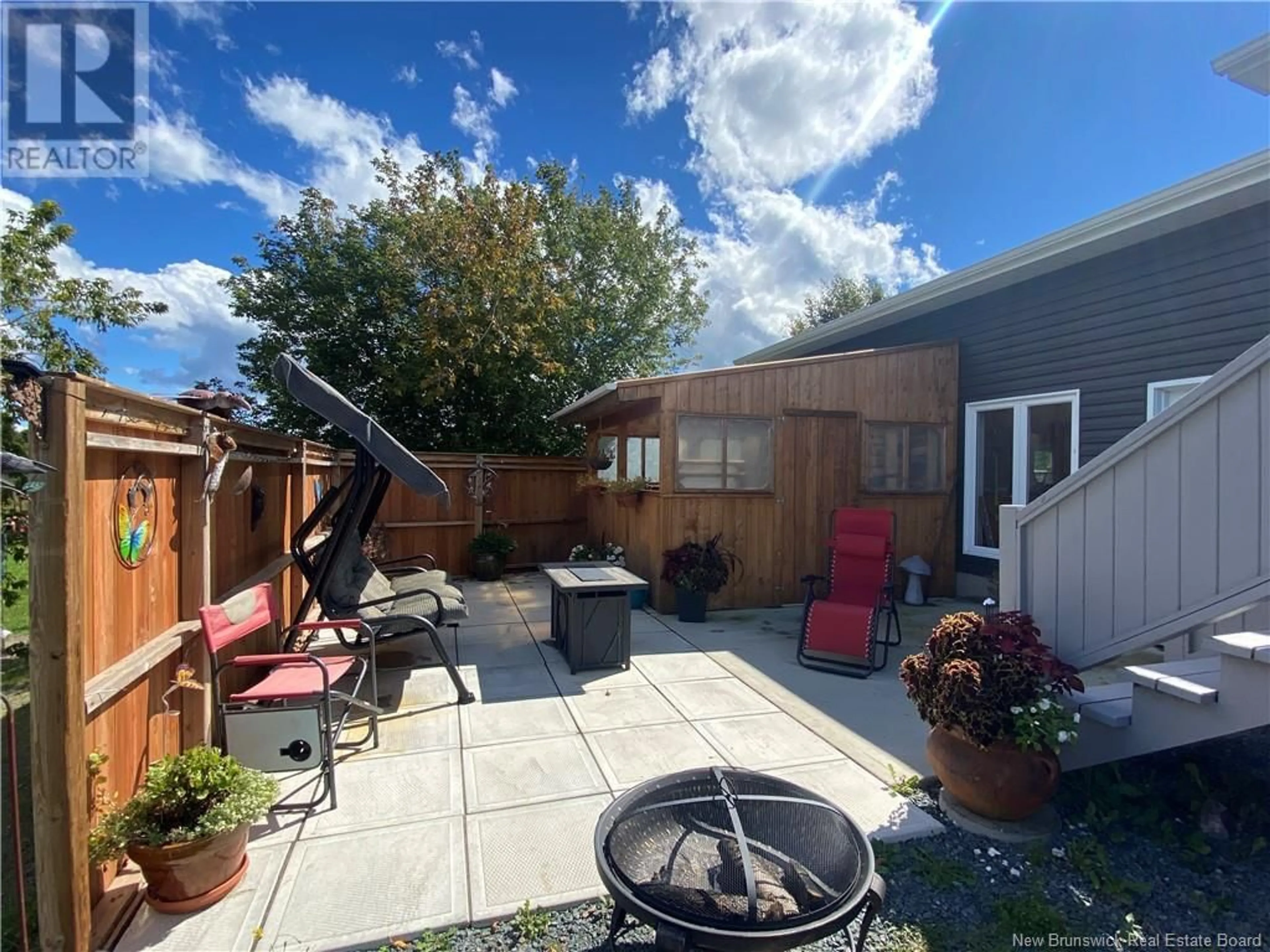 Patio, the fenced backyard for 125 Rue Principale, Pointe-Verte New Brunswick E8J2V8