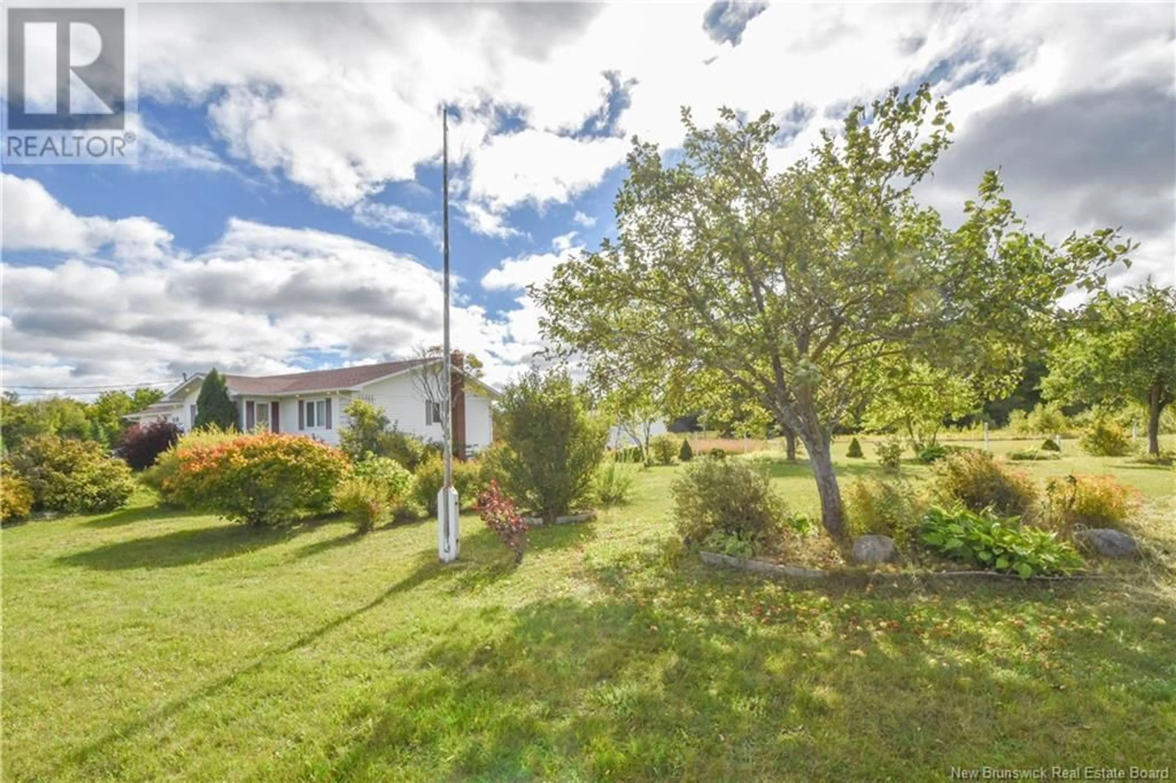 A pic from exterior of the house or condo, the fenced backyard for 852 Principal Road, Petit-Paquetville New Brunswick E8R1H1