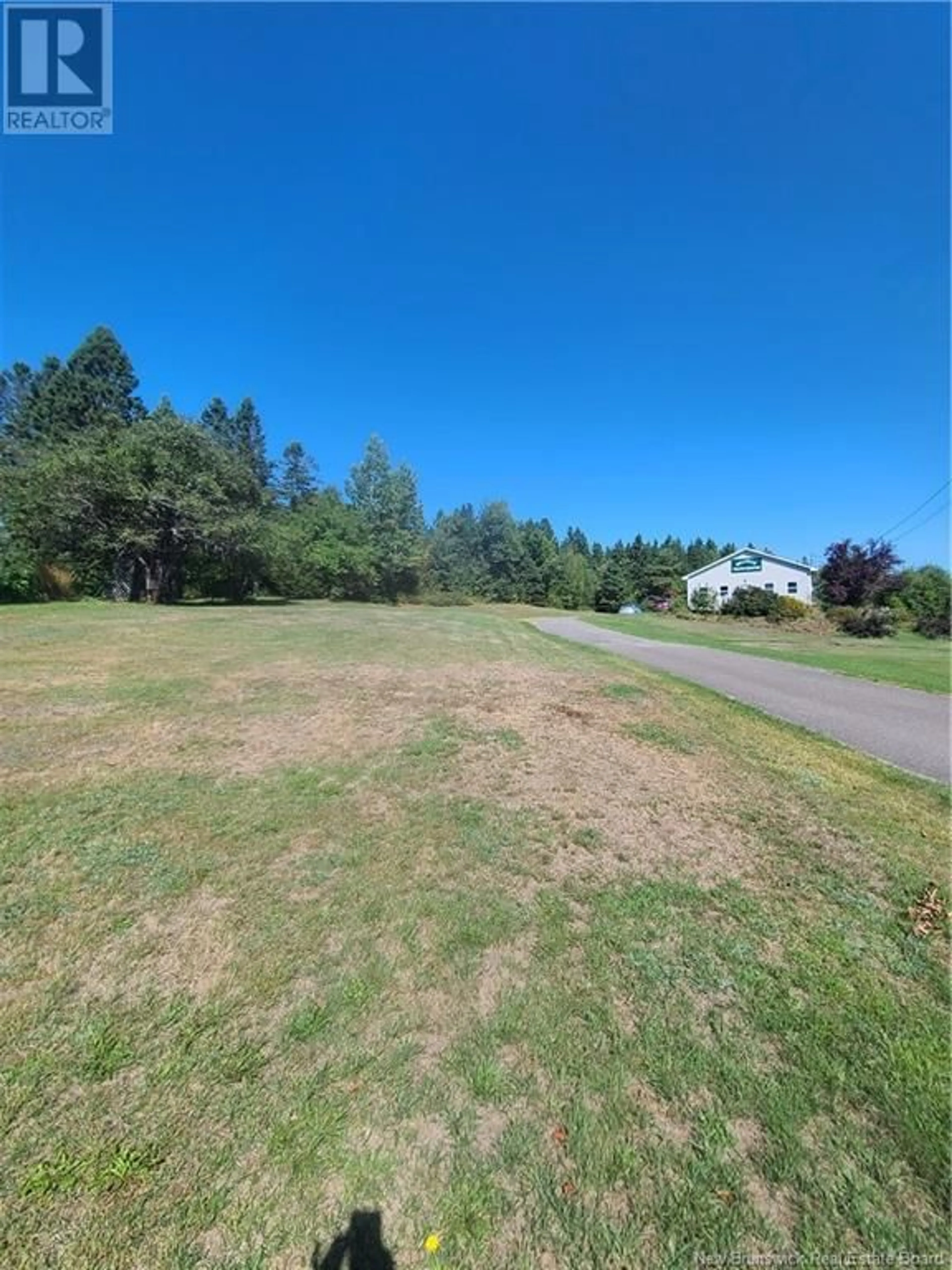 Frontside or backside of a home, the fenced backyard for 33 Howland Ridge Road, Millville New Brunswick E6E1Y3