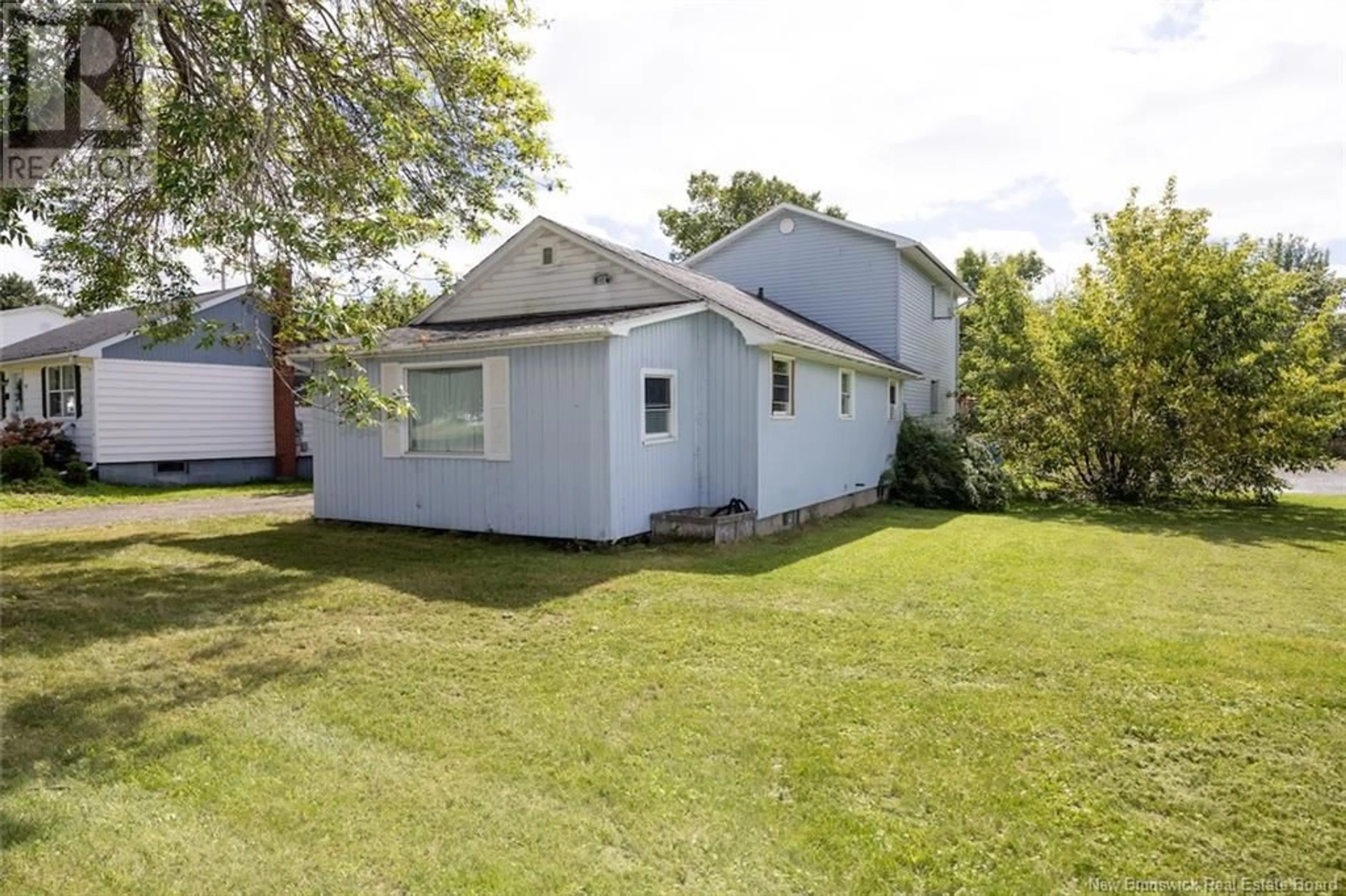 Frontside or backside of a home, the fenced backyard for 14 Hillcourt Drive, Fredericton New Brunswick E3A1S1