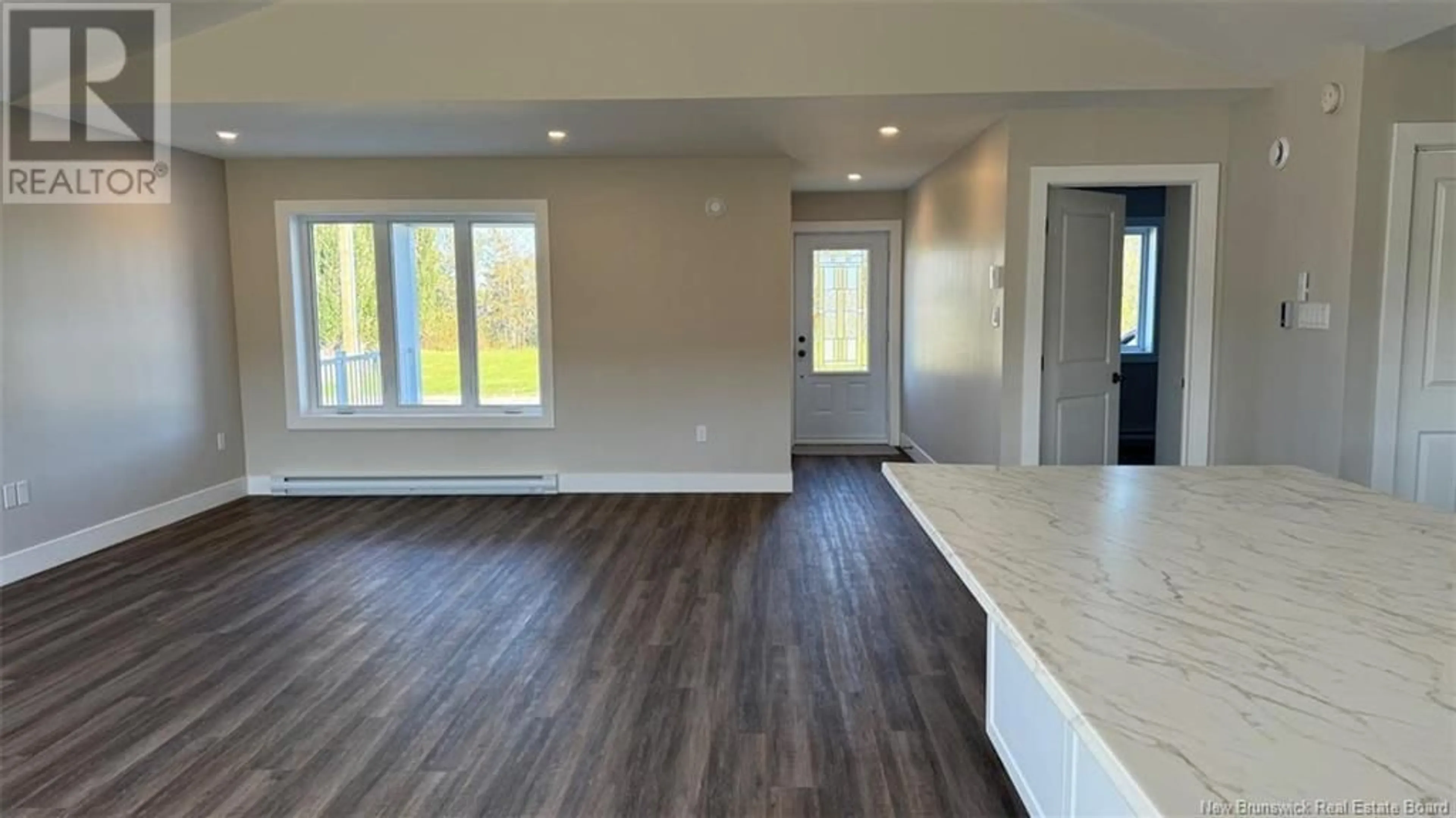 Open concept kitchen, wood/laminate floor for 658 PORTAGE STREET, Grand-Sault/Grand Falls New Brunswick E3Z1M7